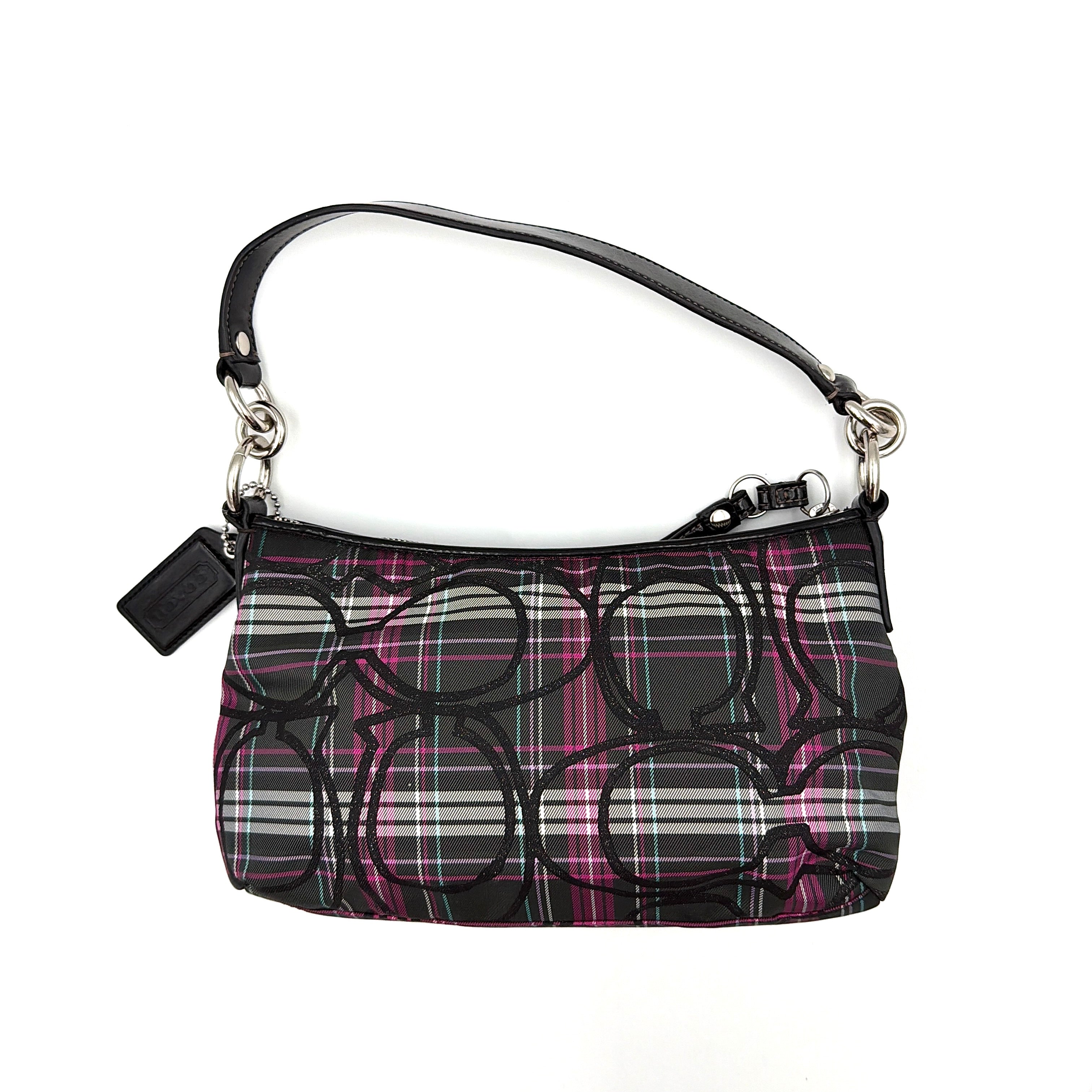 Coach Poppy tartan shoulder bag in black, magenta, and teal plaid with detachable black leather strap and silver-tone hardware.
