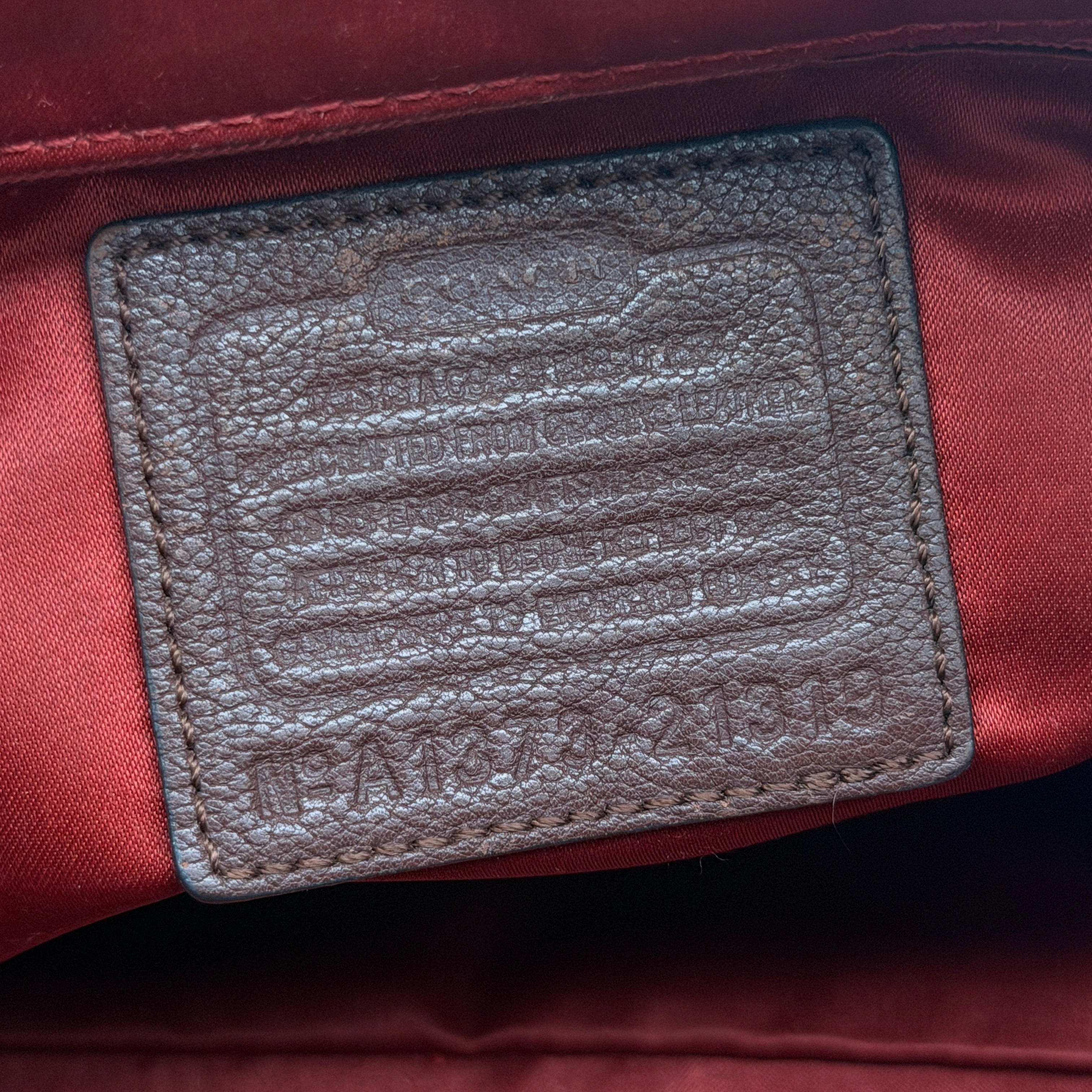Coach Madison Lindsey 2Way handbag in brown python-embossed leather with gold-tone hardware and detachable strap.