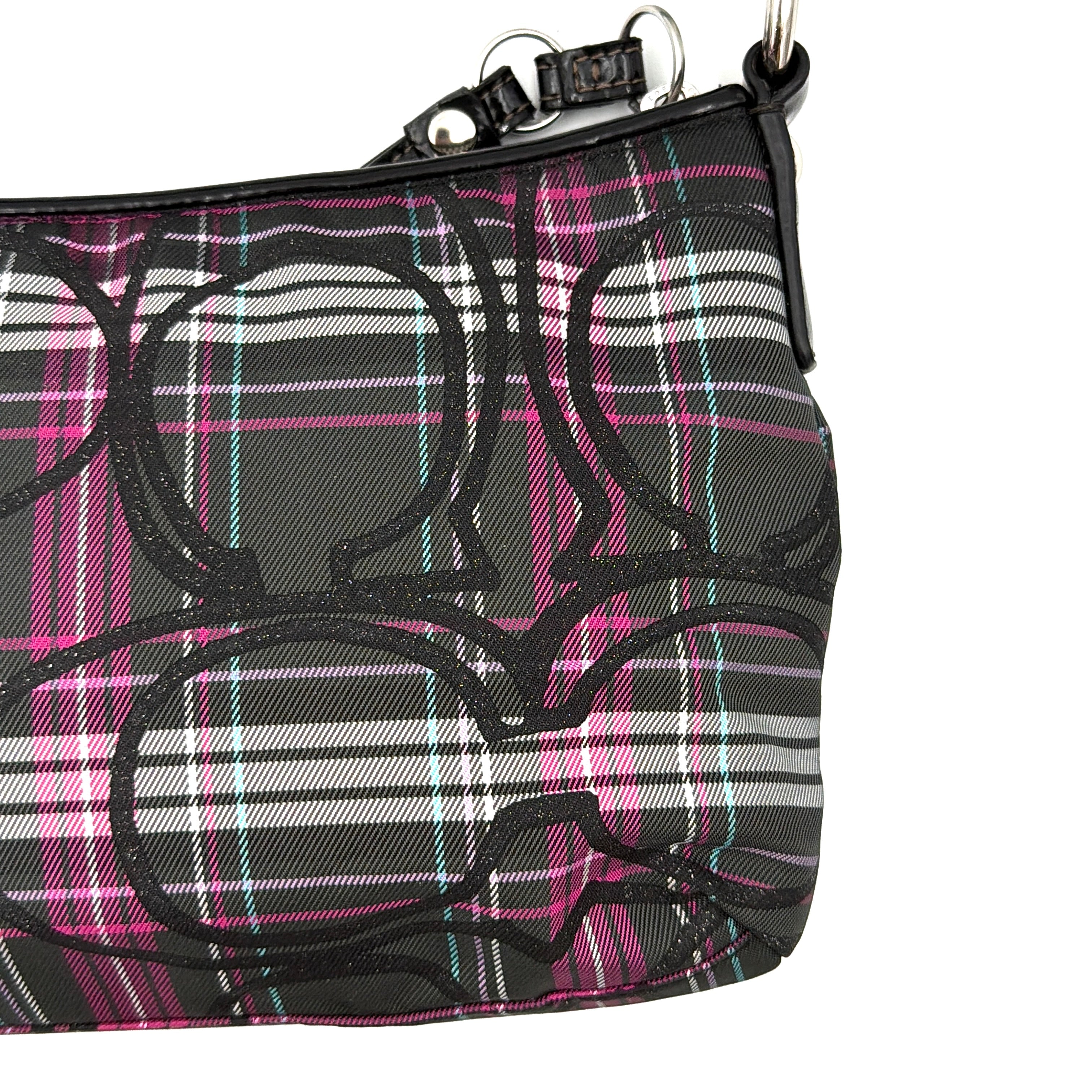 Coach Poppy tartan shoulder bag in black, magenta, and teal plaid with detachable black leather strap and silver-tone hardware.