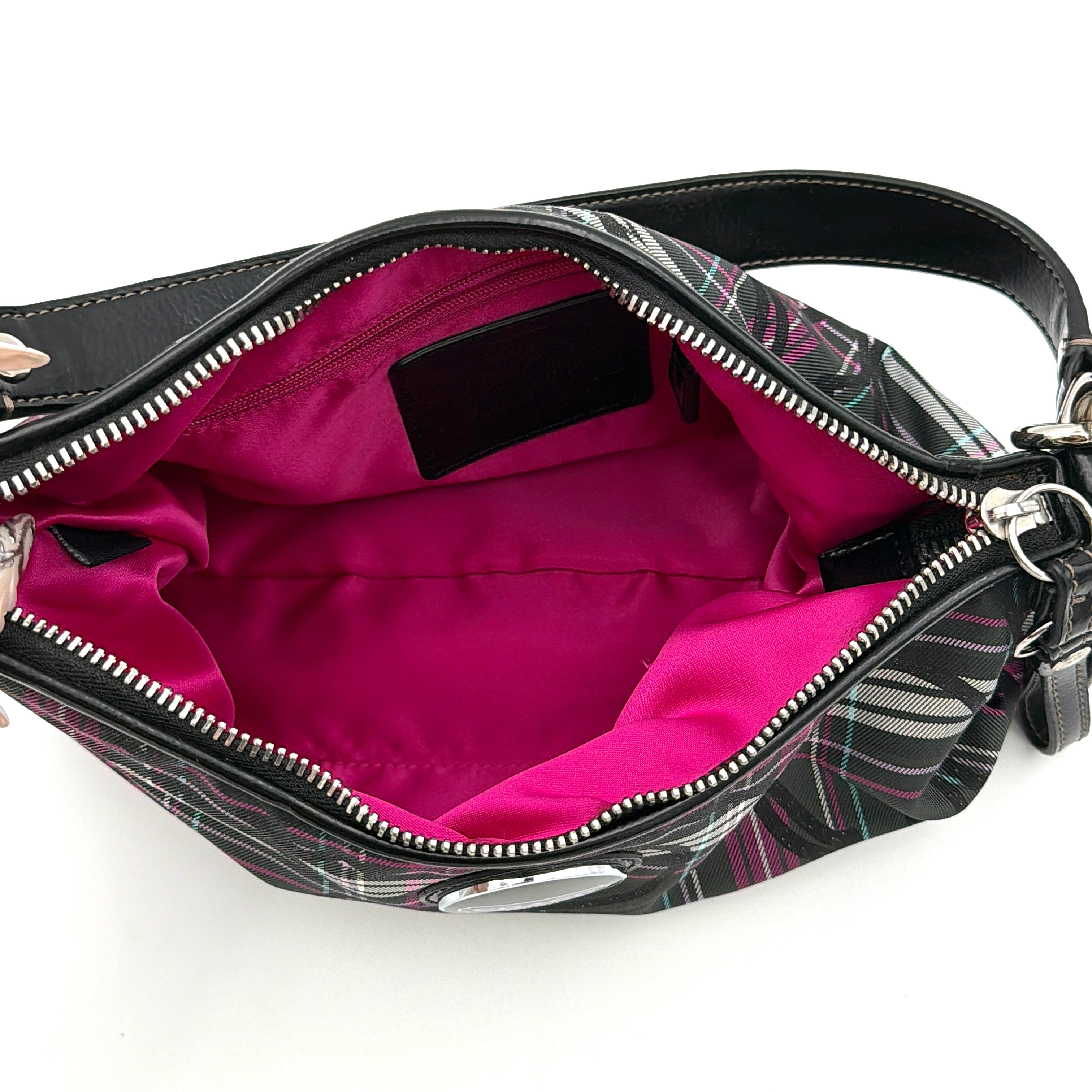 Coach Poppy tartan shoulder bag in black, magenta, and teal plaid with detachable black leather strap and silver-tone hardware.