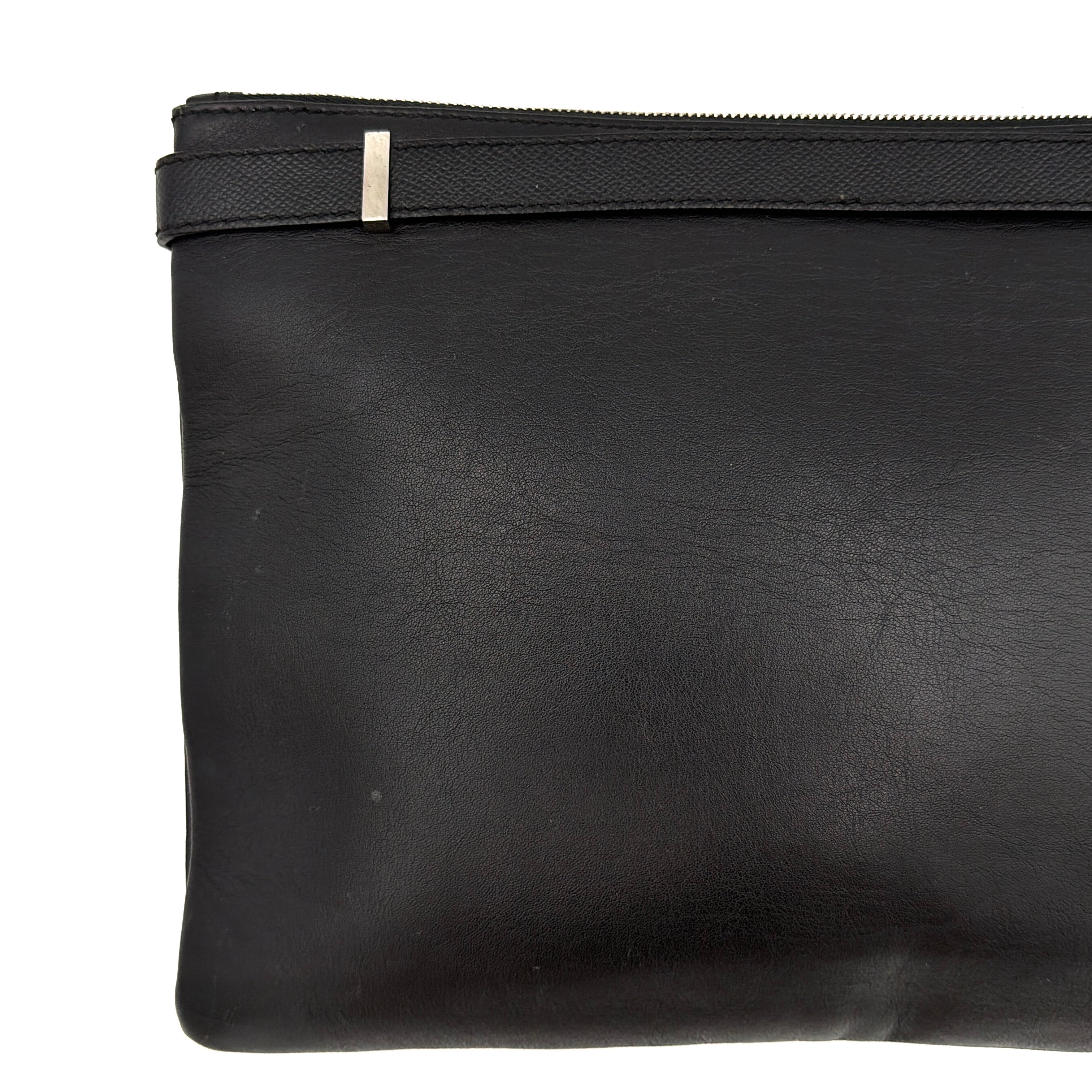 Balenciaga Phileas clutch in smooth black leather with silver hardware, shown against a white background.