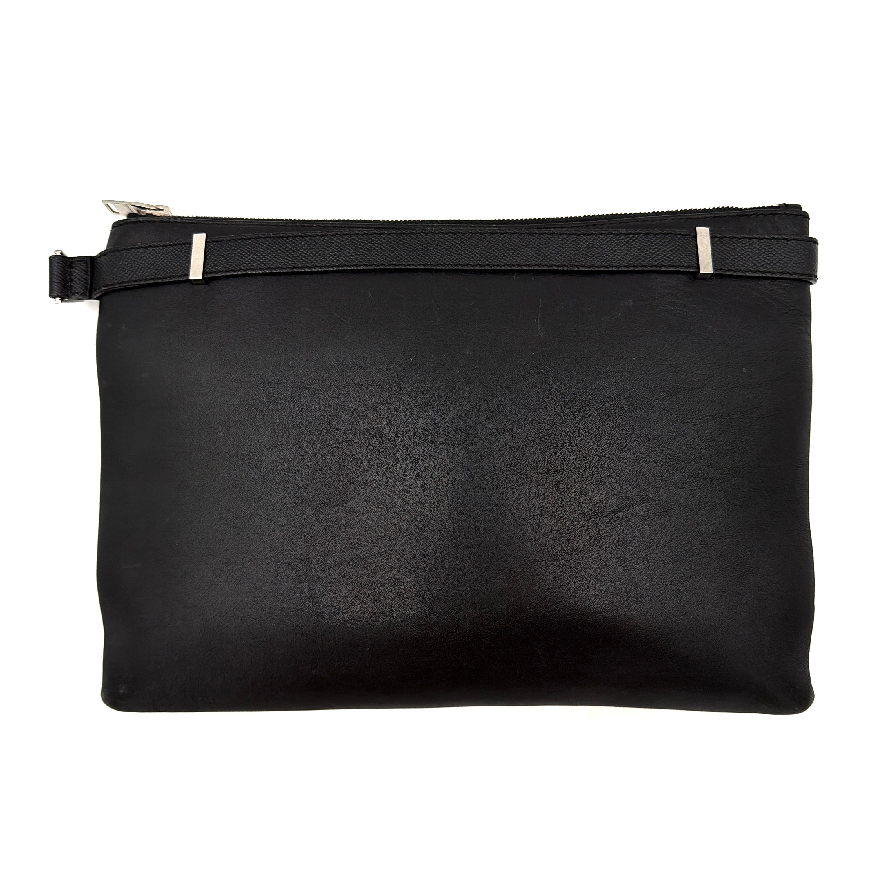 Balenciaga Phileas clutch in smooth black leather with silver hardware, shown against a white background.