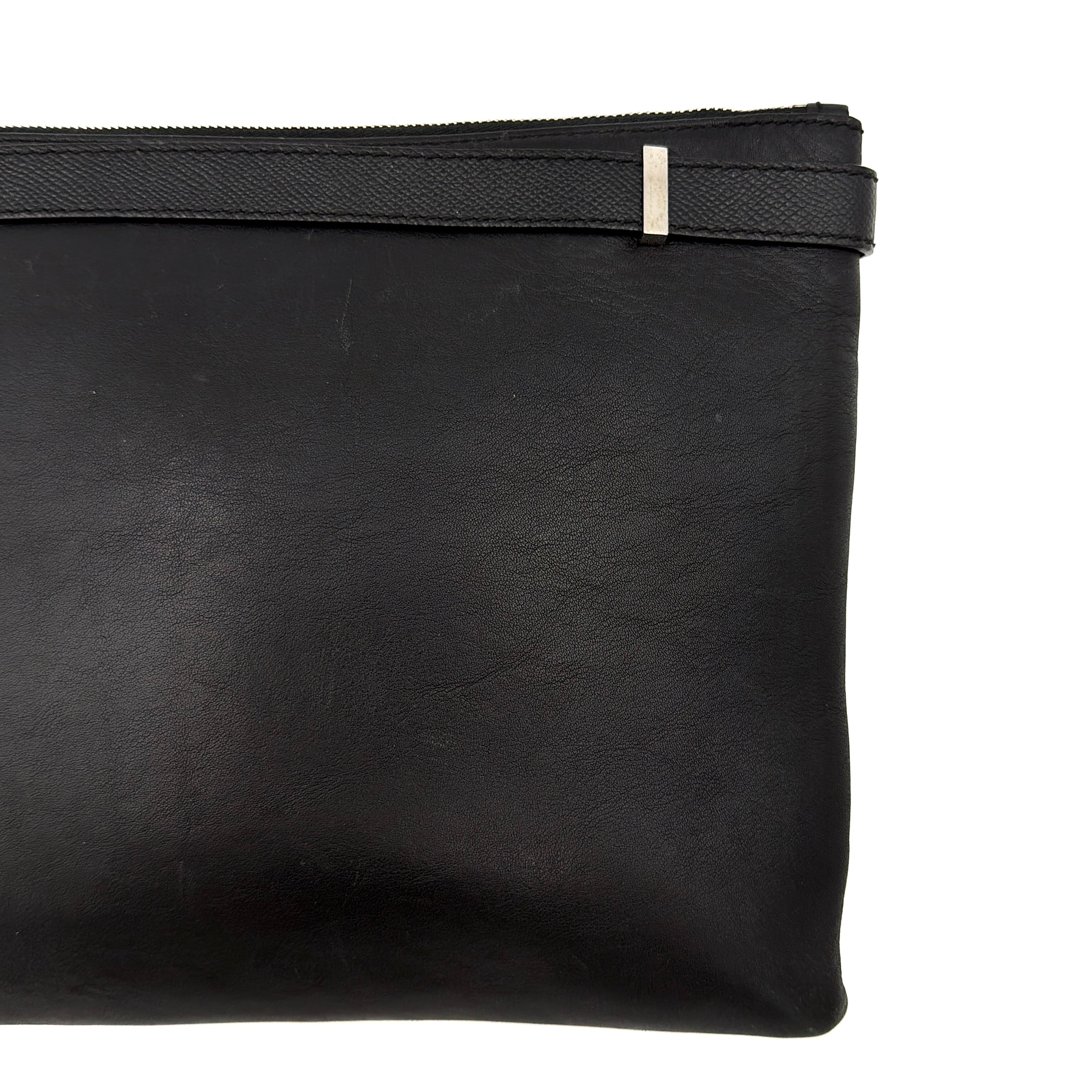 Balenciaga Phileas clutch in smooth black leather with silver hardware, shown against a white background.