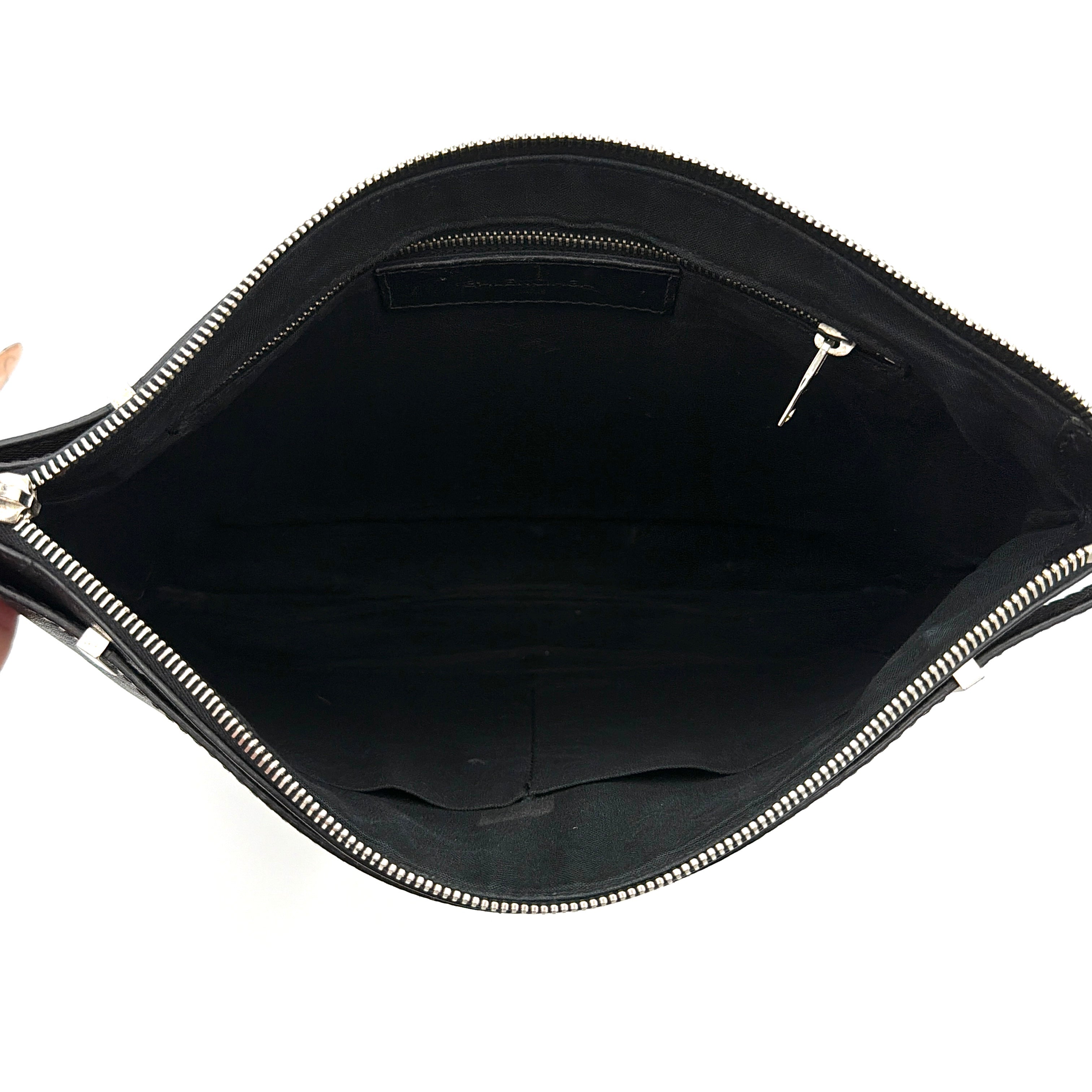 Balenciaga Phileas clutch in smooth black leather with silver hardware, shown against a white background.