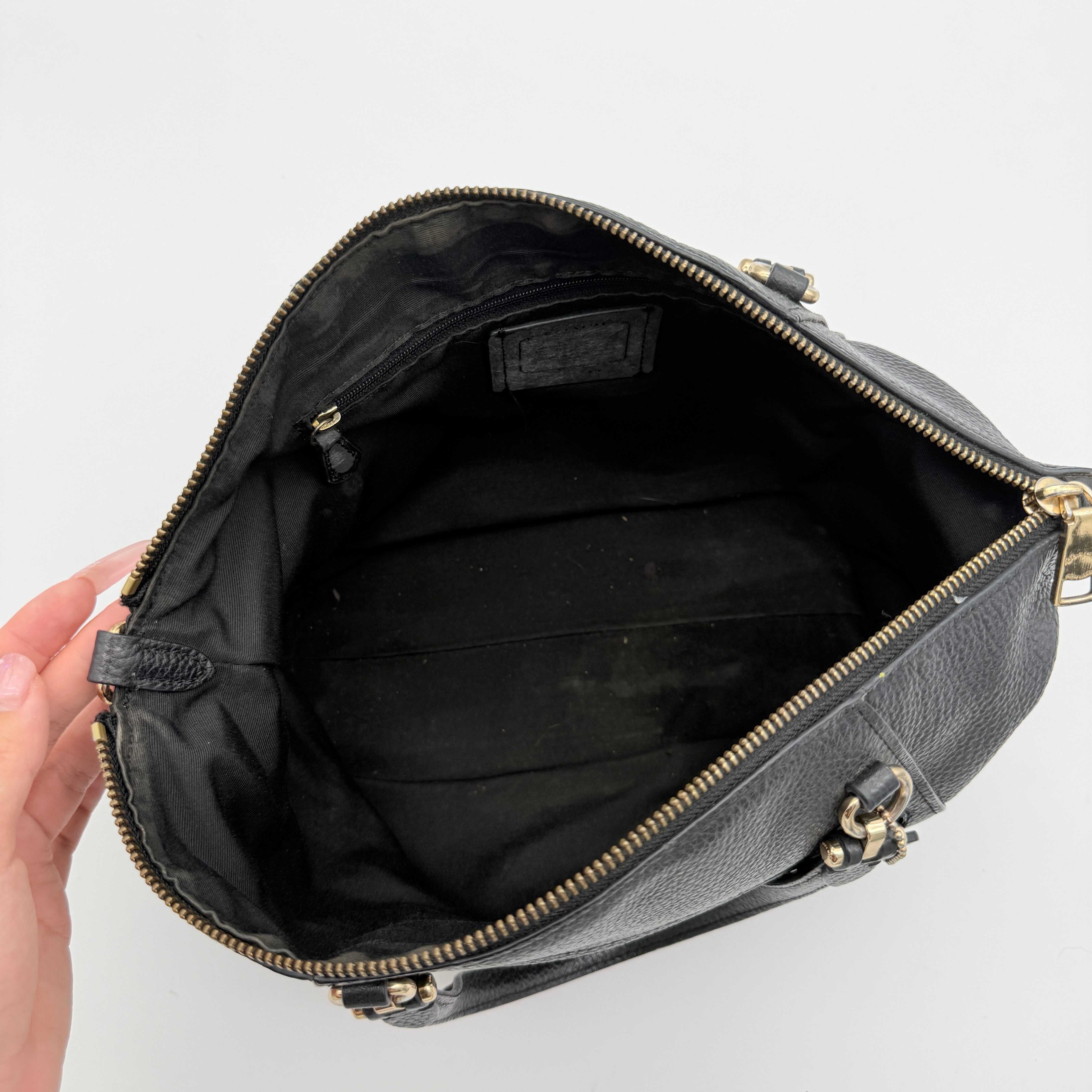 Coach 2Way Prairie Satchel in black grained leather with gold-tone hardware, shown with detachable strap and branded dust bag.