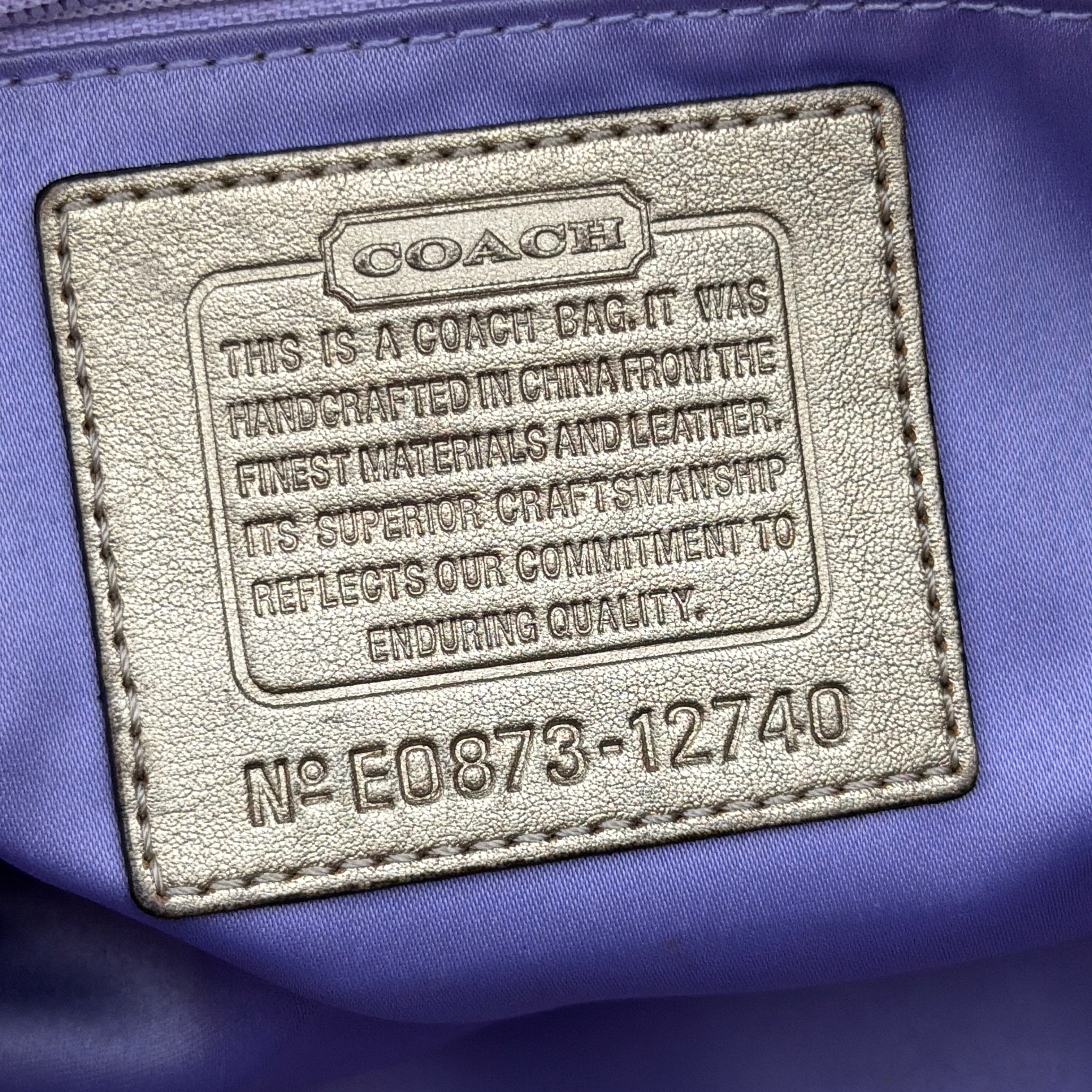 Coach Gallery Tote in mosaic patchwork jacquard and gold leather with signature charms and adjustable handles.