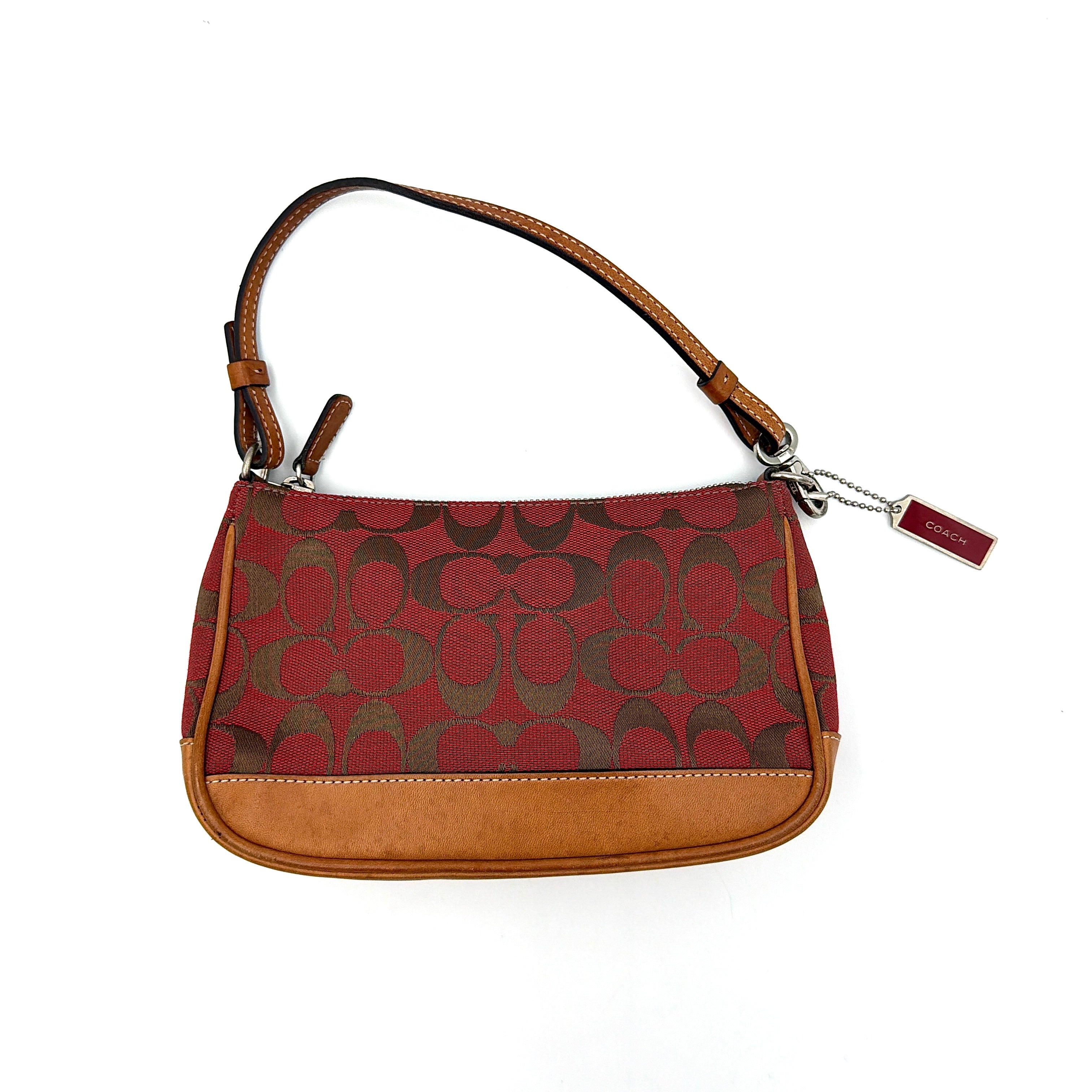 Coach Y2K Demi Shoulder Bag in red jacquard canvas with tan leather trim and silver-tone hardware, featuring a signature enamel Coach hangtag.