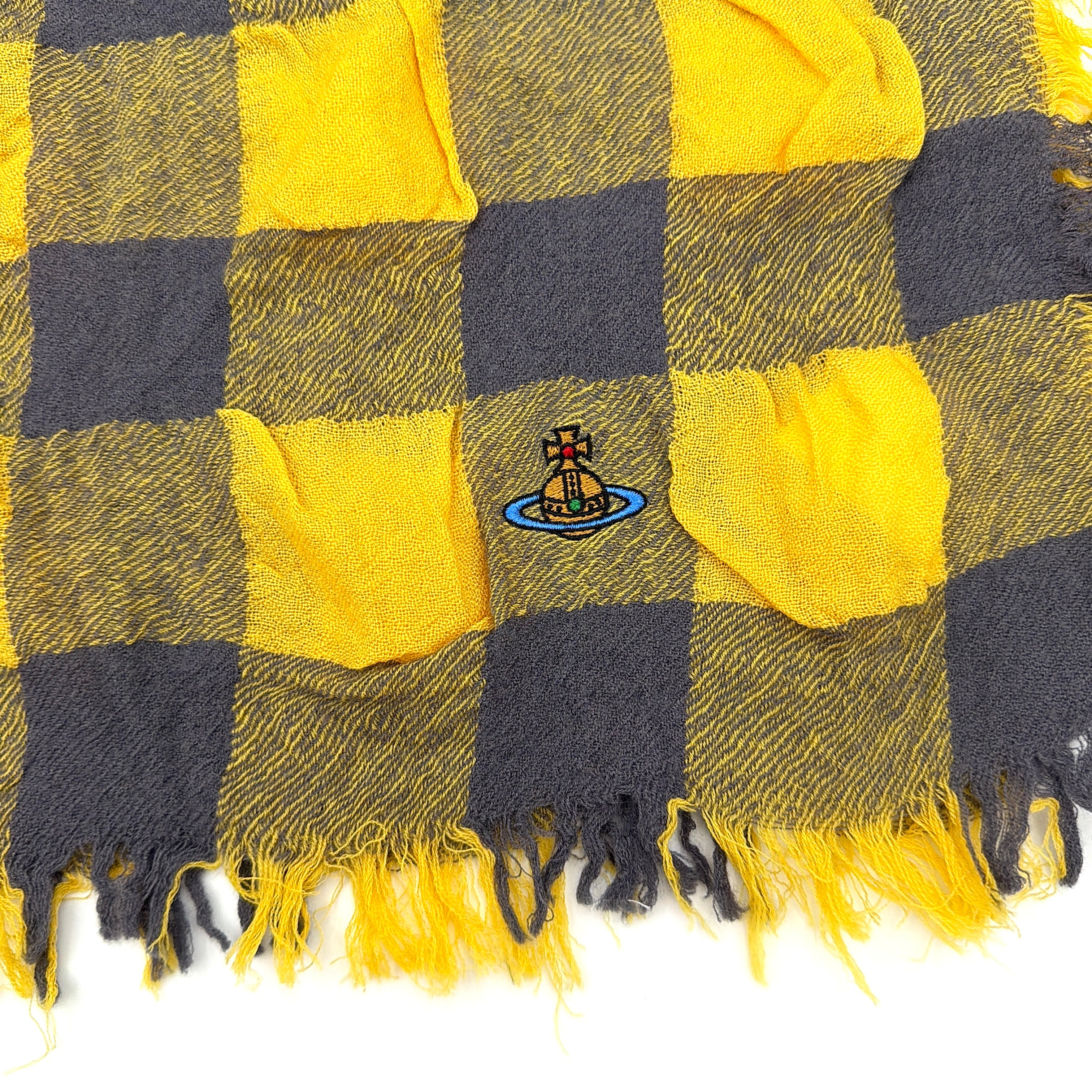 Vivienne Westwood yellow and grey check scarf with fringed edges and signature orb embroidery, artfully draped.