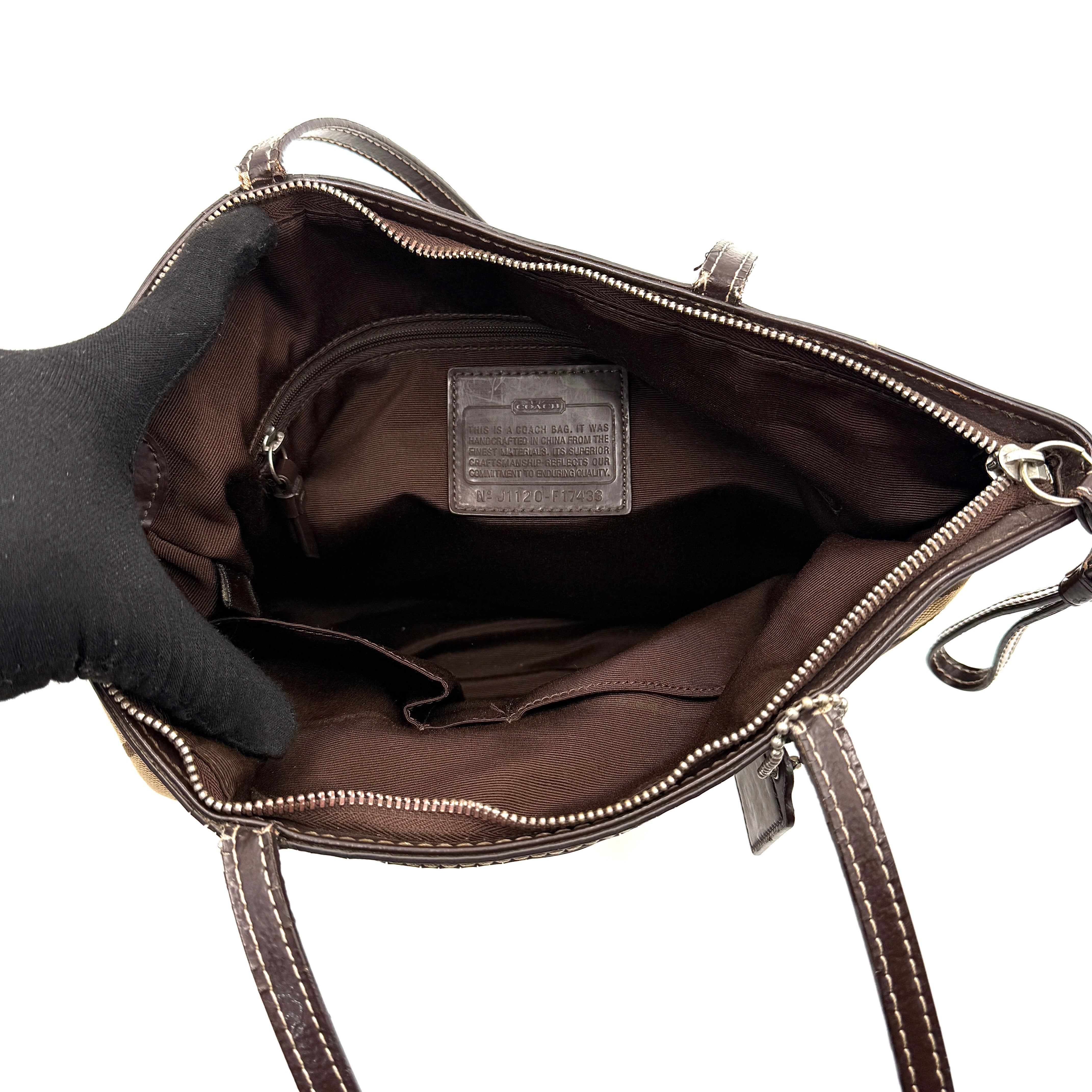 Coach Signature Stripe Tote Bag in beige and brown with bold monogram canvas, leather trim, and dual shoulder straps.