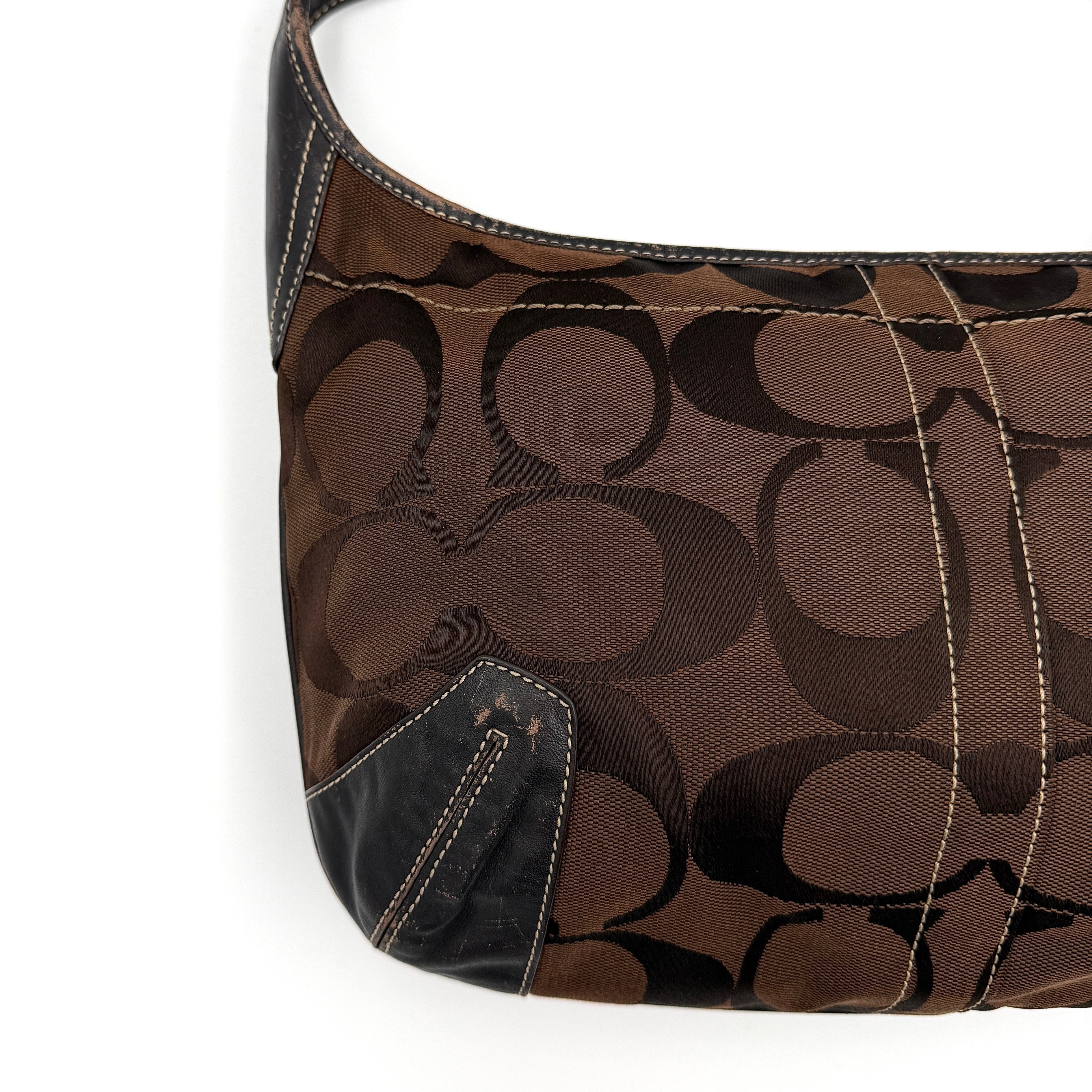 Coach Signature Ergo Hobo Shoulder Bag in brown monogram canvas with dark leather trim and gold-tone hardware, shown from the front.