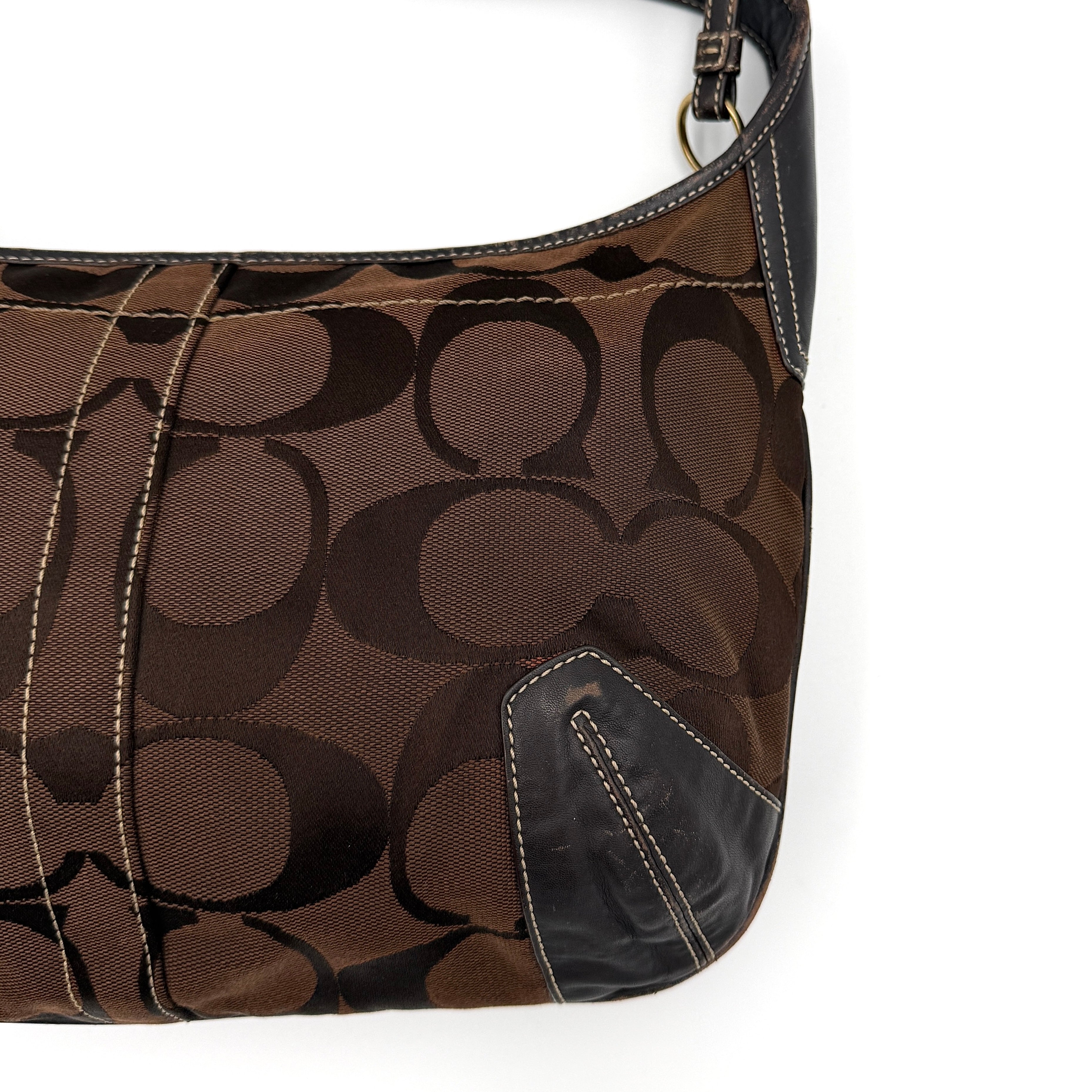 Coach Signature Ergo Hobo Shoulder Bag in brown monogram canvas with dark leather trim and gold-tone hardware, shown from the front.