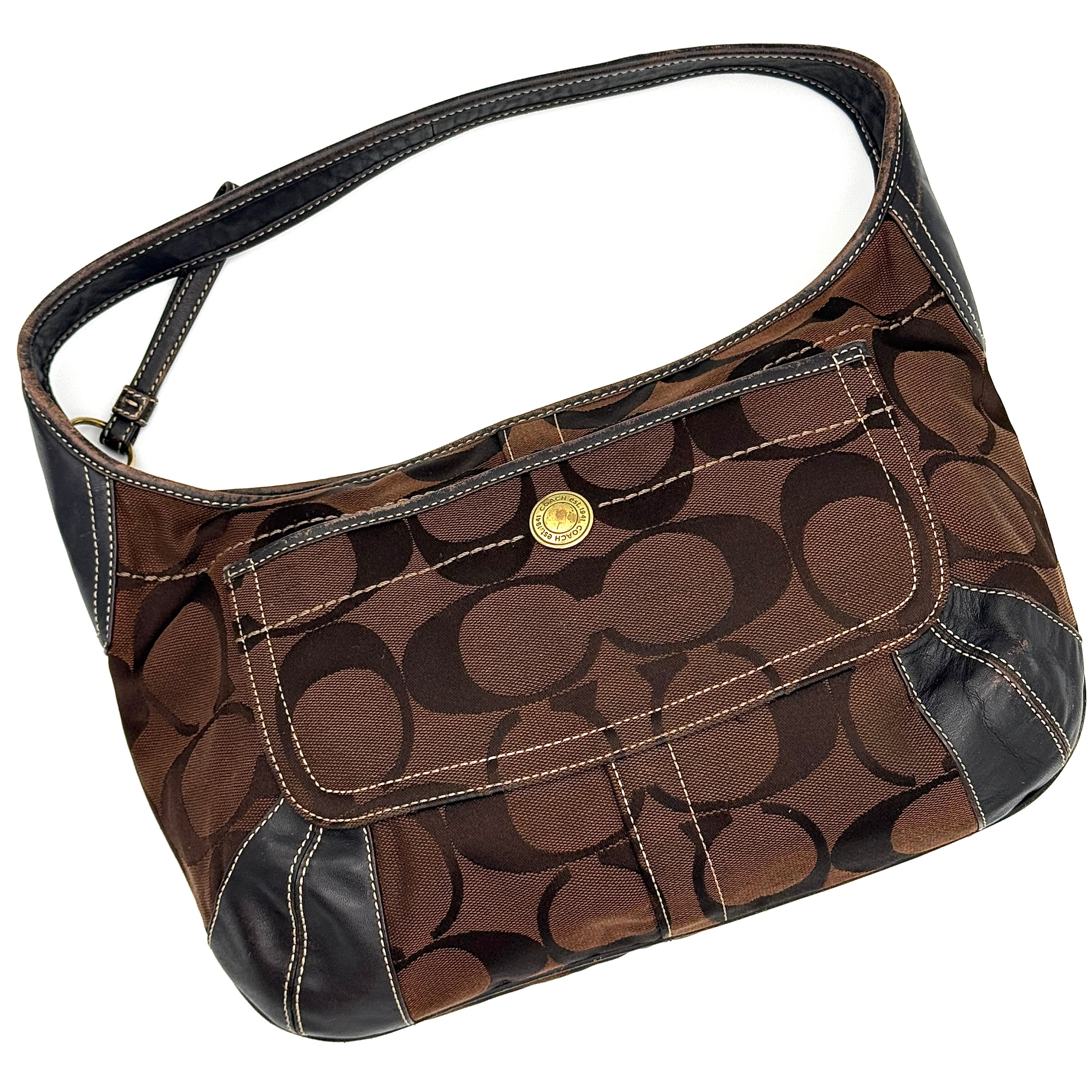 Coach Signature Ergo Hobo Shoulder Bag in brown monogram canvas with dark leather trim and gold-tone hardware, shown from the front.