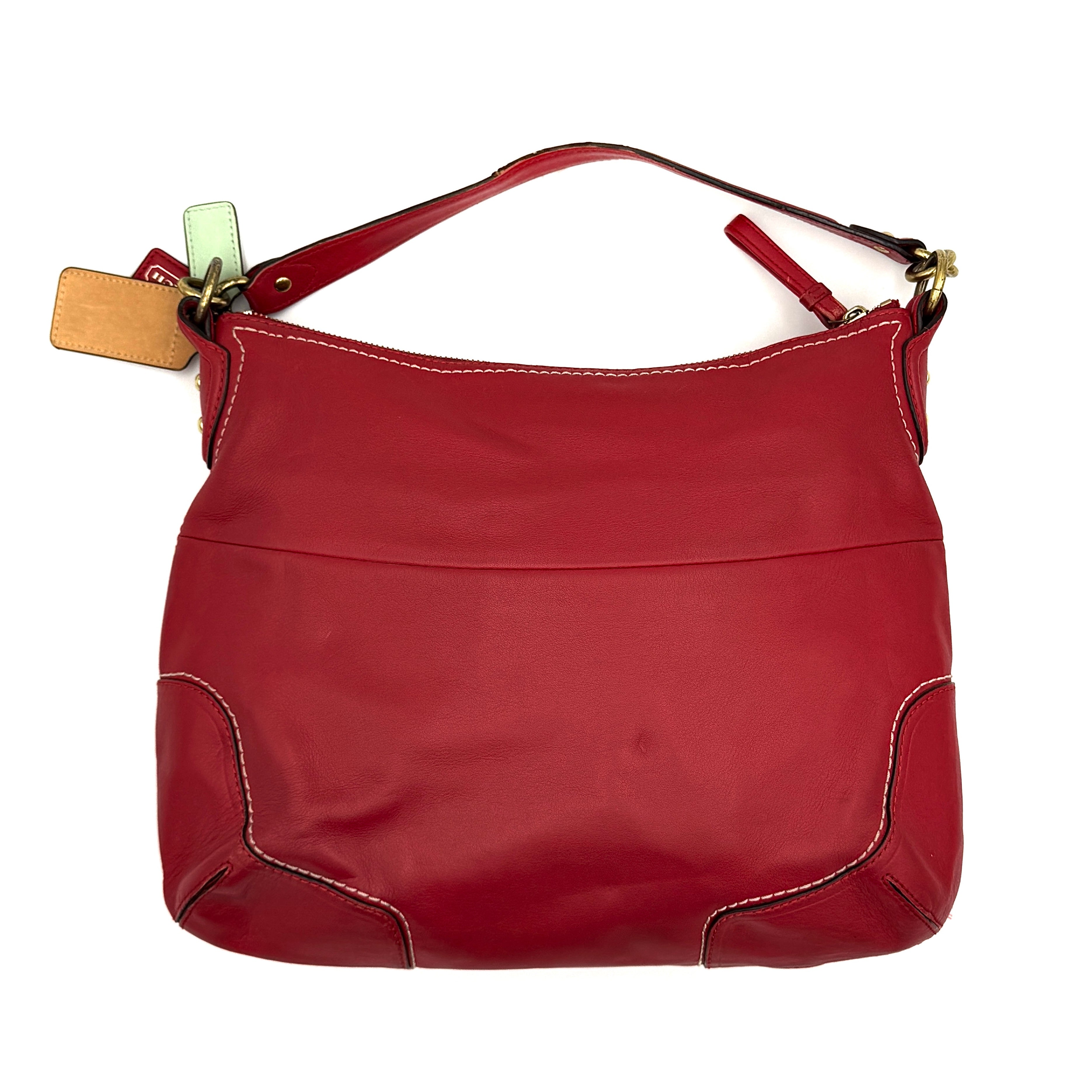 Coach Ashley Double Pocket Hobo in vibrant red leather, featuring distinctive front pockets, gold-tone hardware, and signature Coach hangtags.