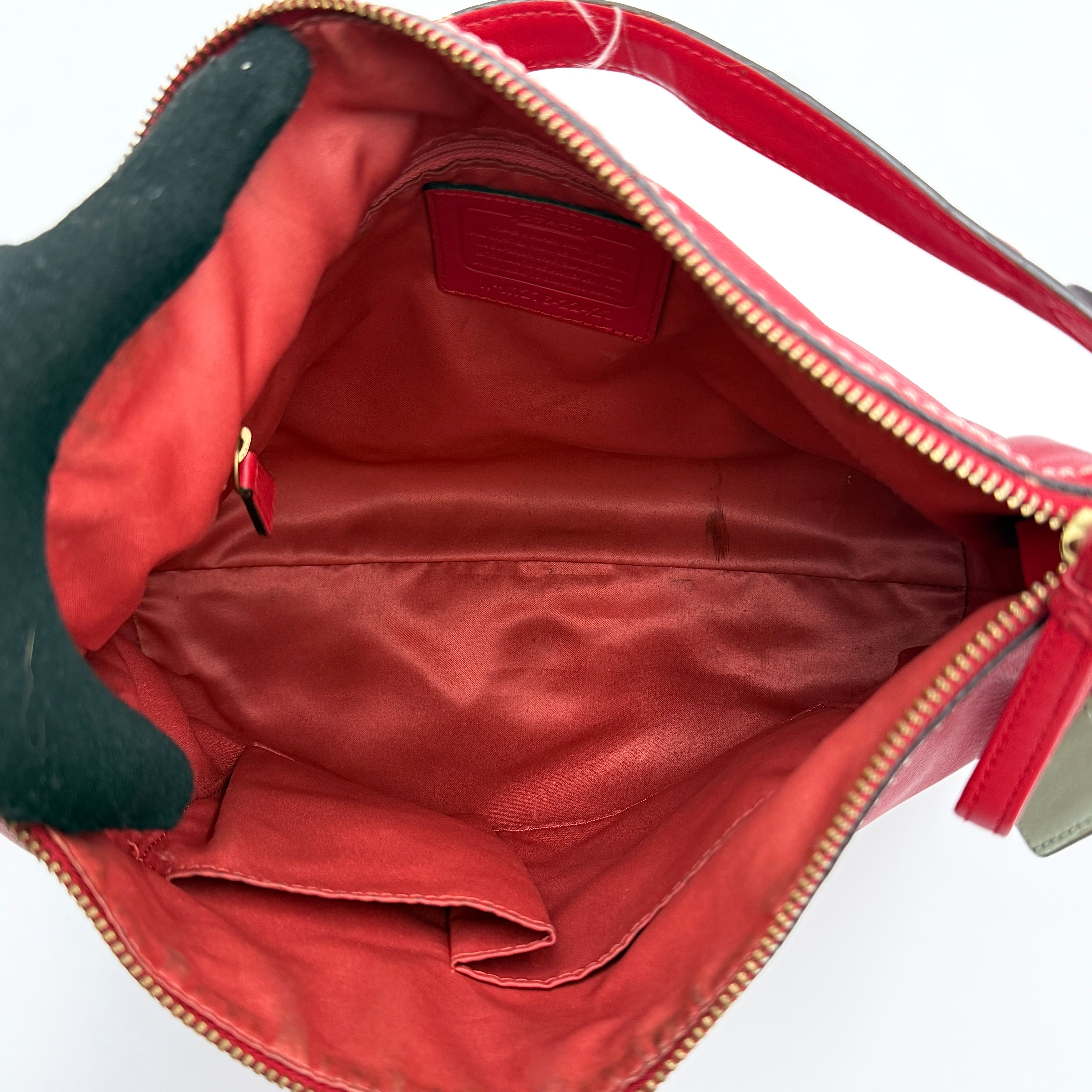 Coach Ashley Double Pocket Hobo in vibrant red leather, featuring distinctive front pockets, gold-tone hardware, and signature Coach hangtags.