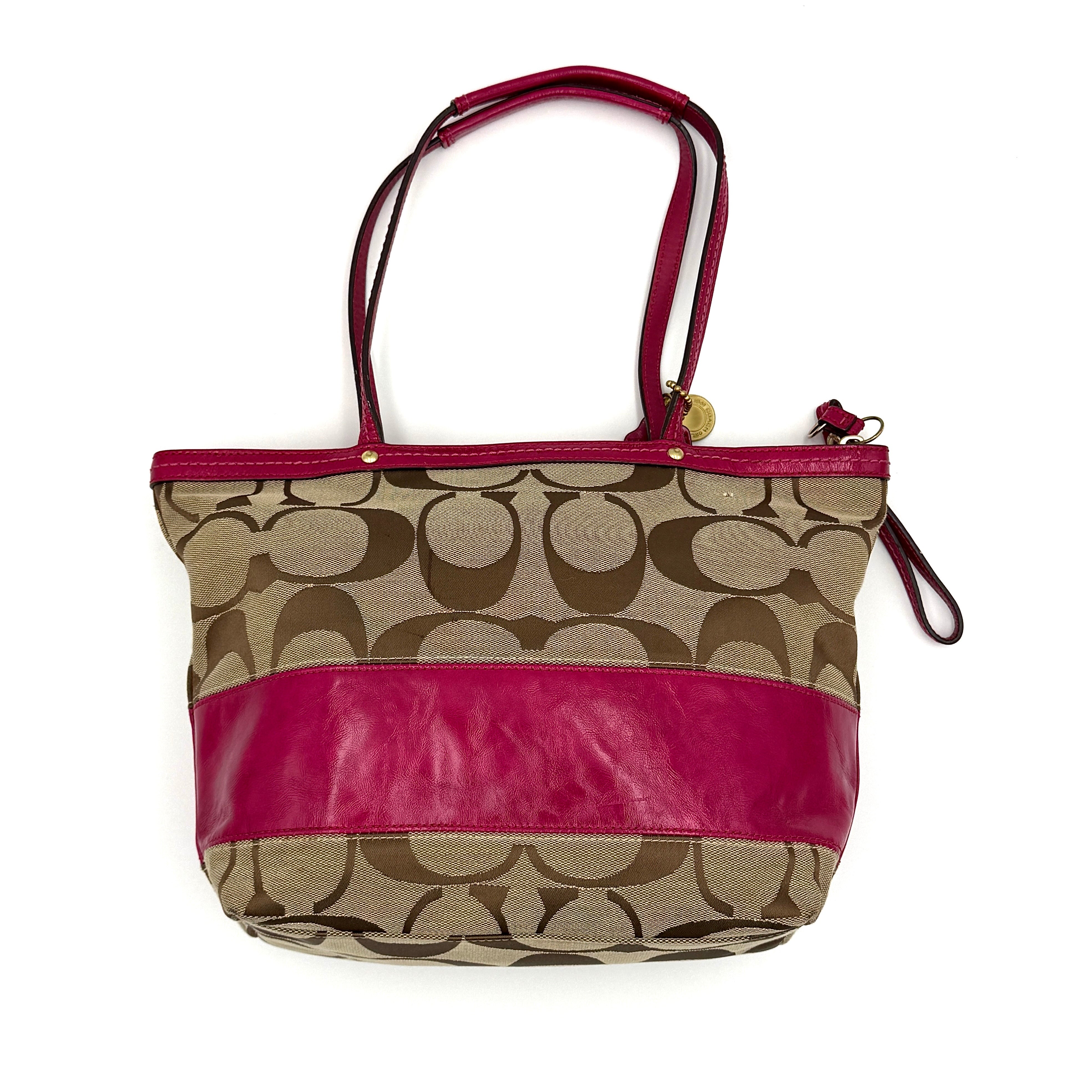 Coach Signature Stripe Tote Bag in beige monogram canvas with bold pink leather accents and top handles.