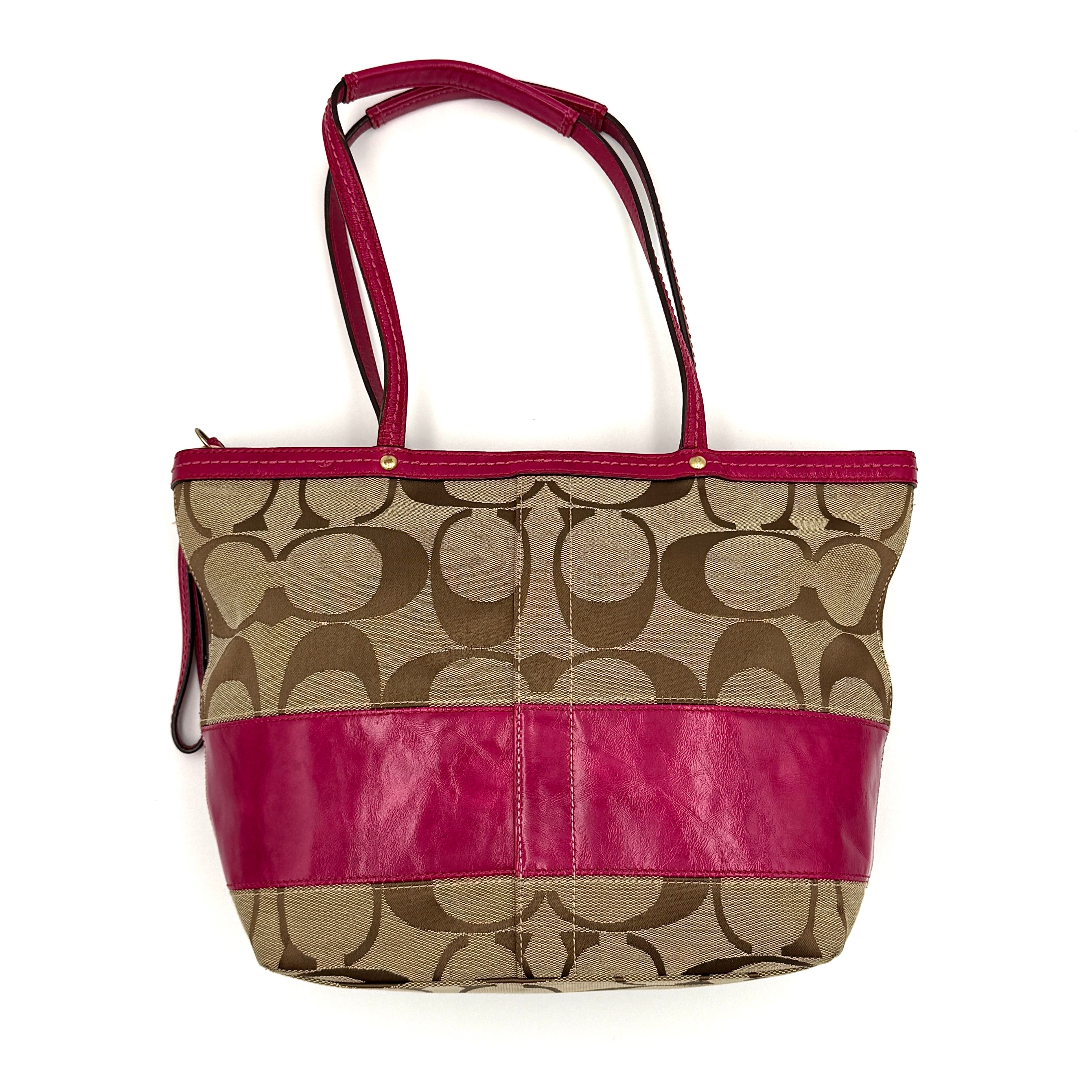 Coach Signature Stripe Tote Bag in beige monogram canvas with bold pink leather accents and top handles.