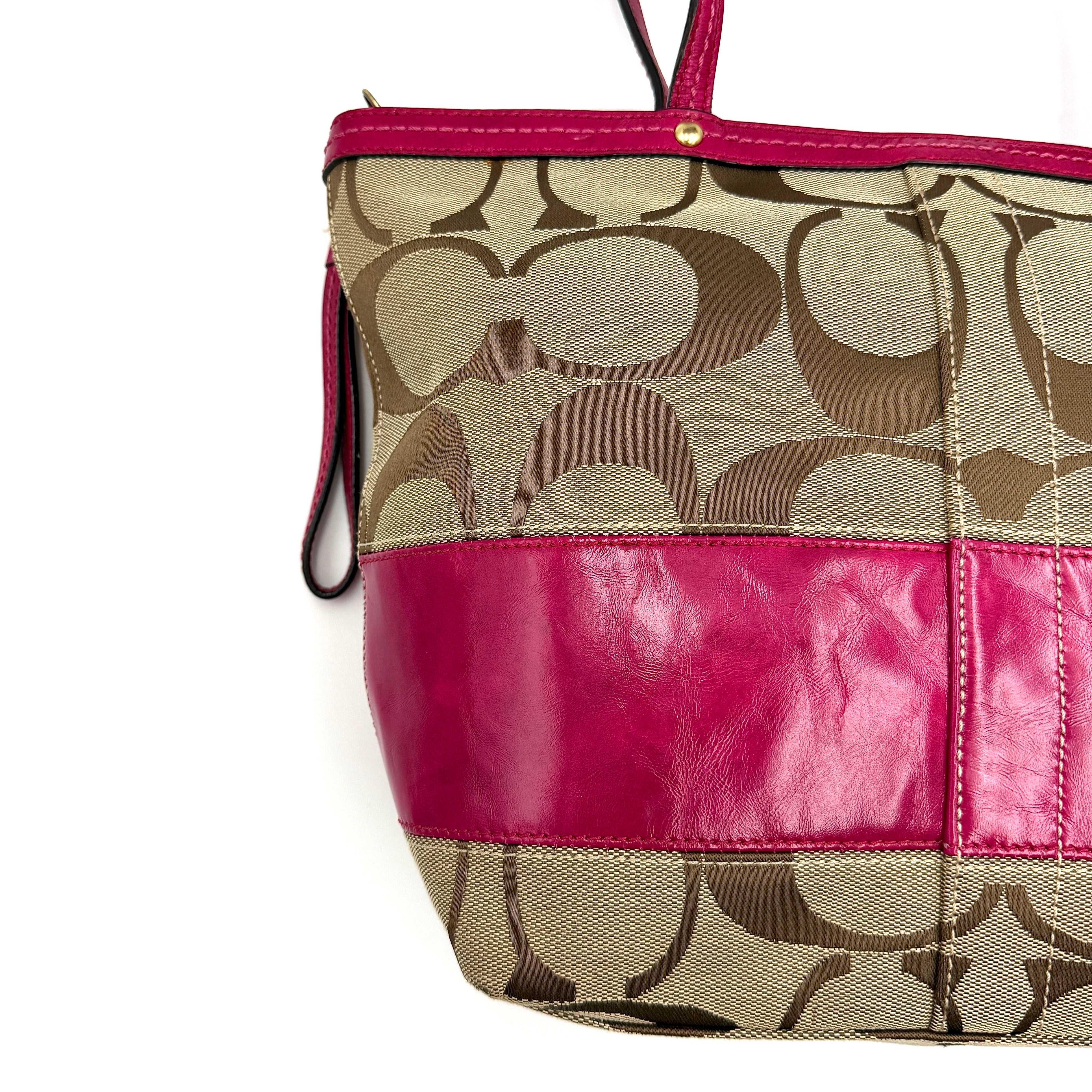 Coach Signature Stripe Tote Bag in beige monogram canvas with bold pink leather accents and top handles.