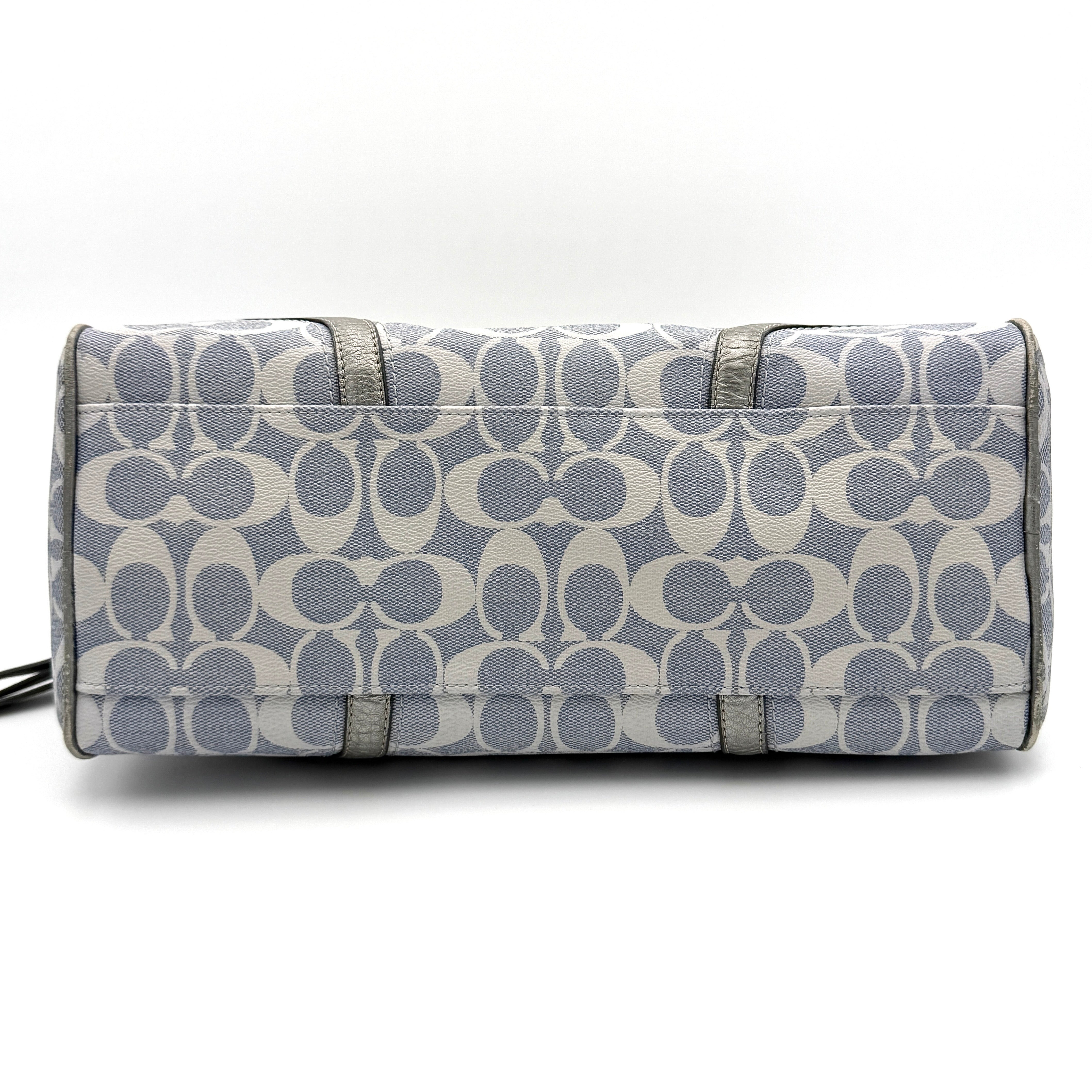 Coach Signature Peyton Satchel in light blue and grey canvas with metallic leather trim and double handles, shown against a white background.