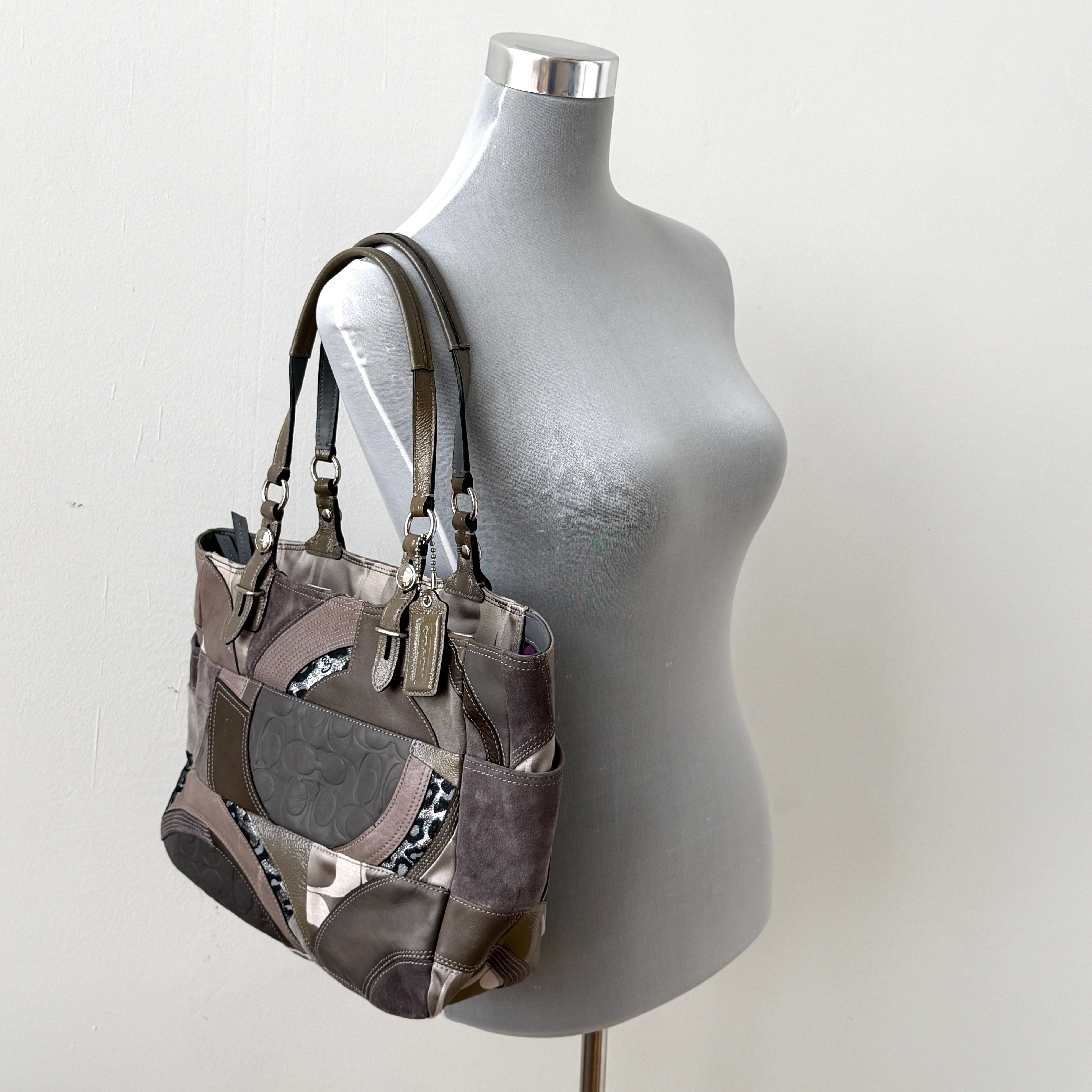 Coach Y2K patchwork tote in grey tones with jacquard, suede, and ocelot-print panels, shown with double handles and signature tag.