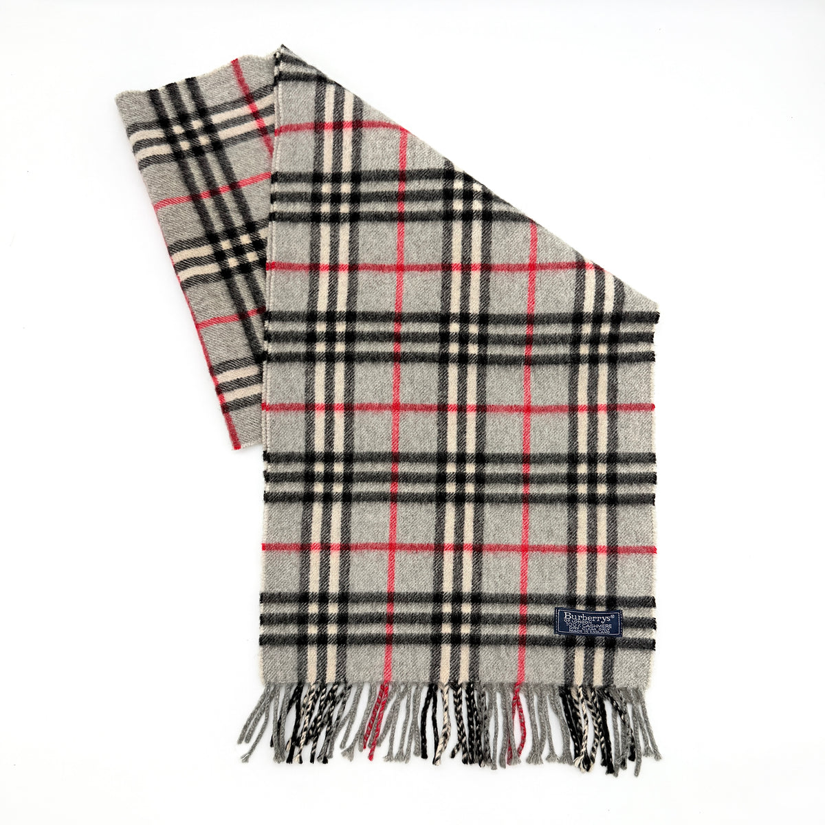 Burberry London grey Nova Check cashmere scarf with classic check pattern and fringe ends, shown carefully folded.