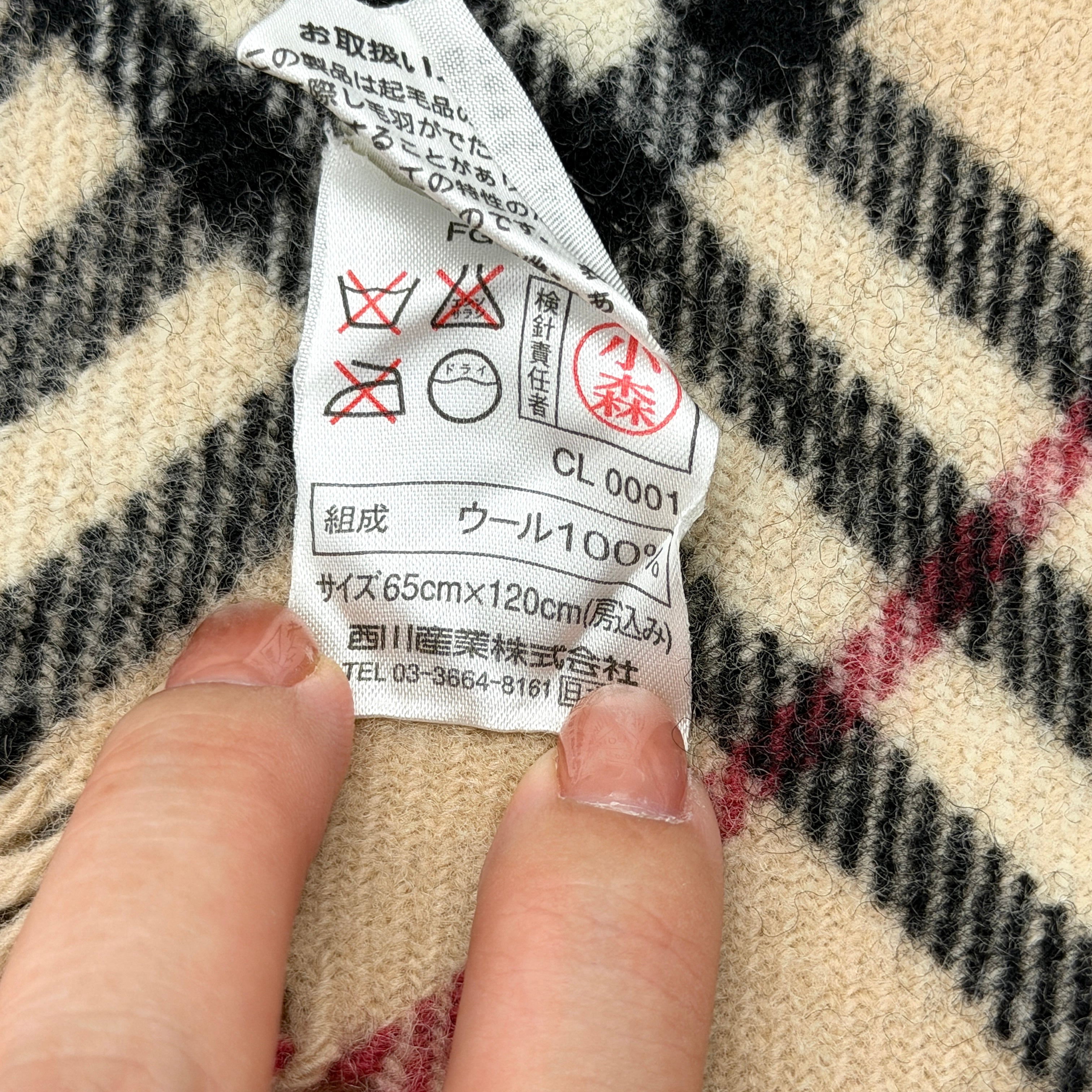 Burberry Nova Check wool scarf with fringed edges and embroidered logo in a beige, black, and red tartan pattern.