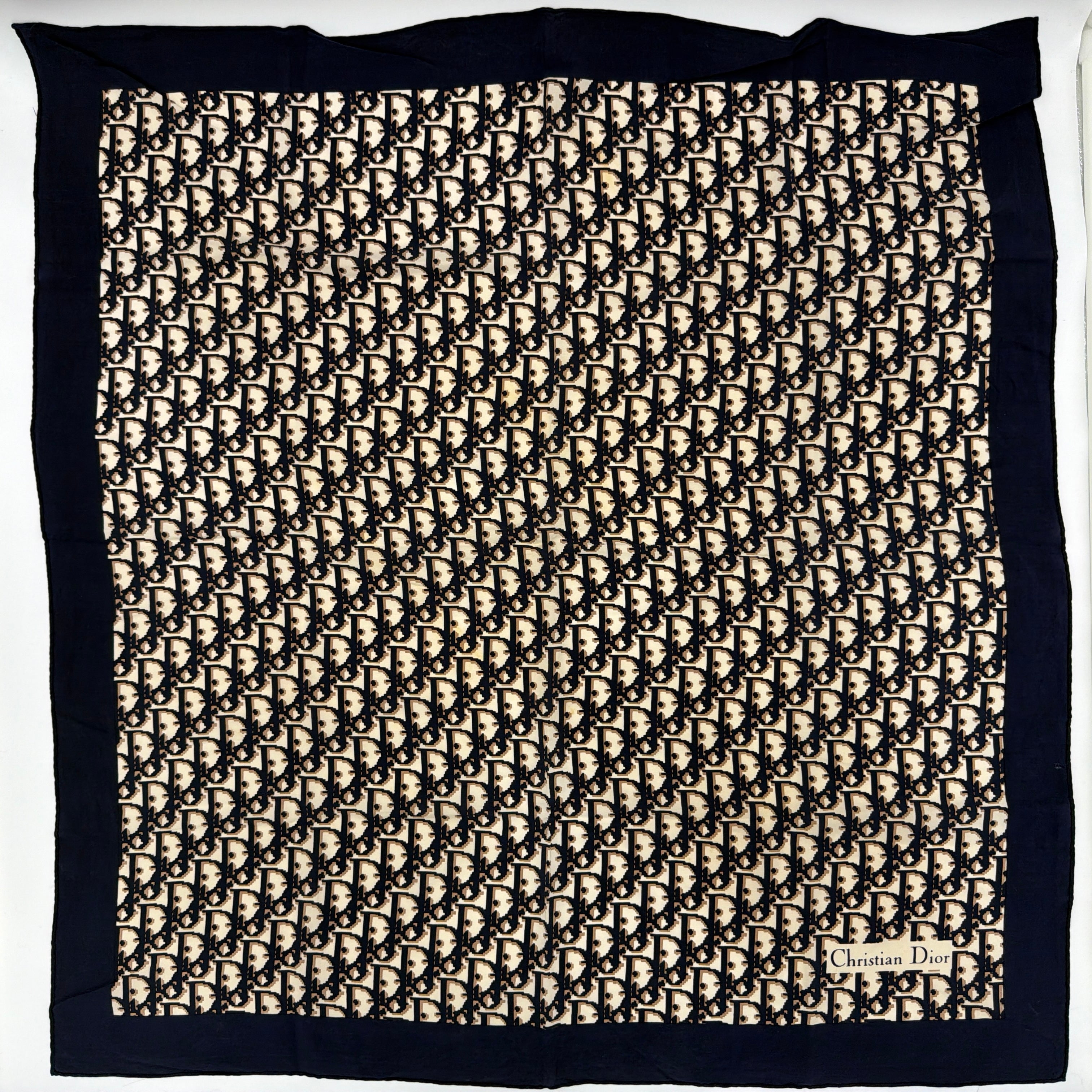 Dior Monogram Silk Scarf in navy blue and cream, featuring the classic oblique CD pattern and a navy border with a Christian Dior signature.