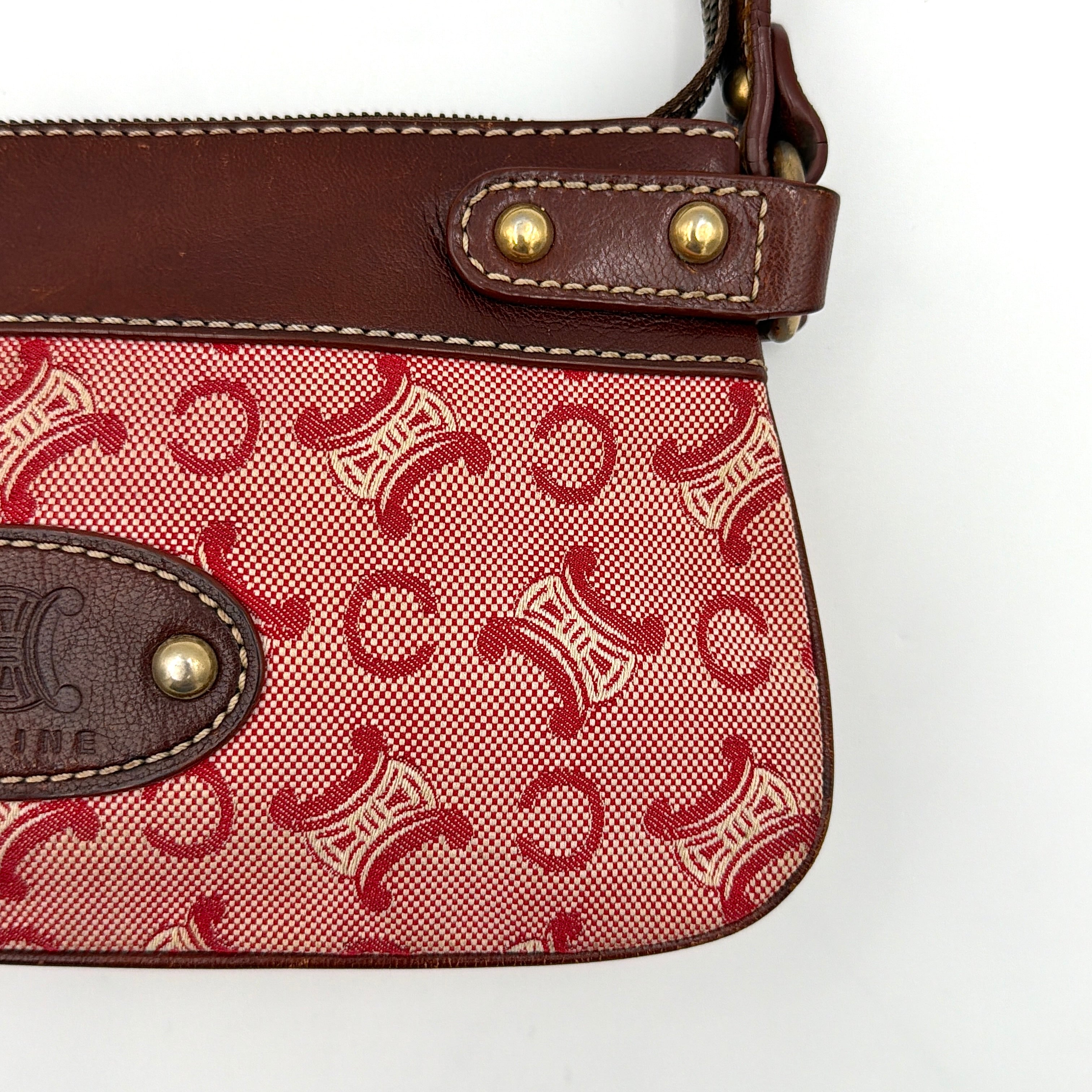 Celine Macadam shoulder bag in red coated canvas with brown leather trim and gold-tone hardware.