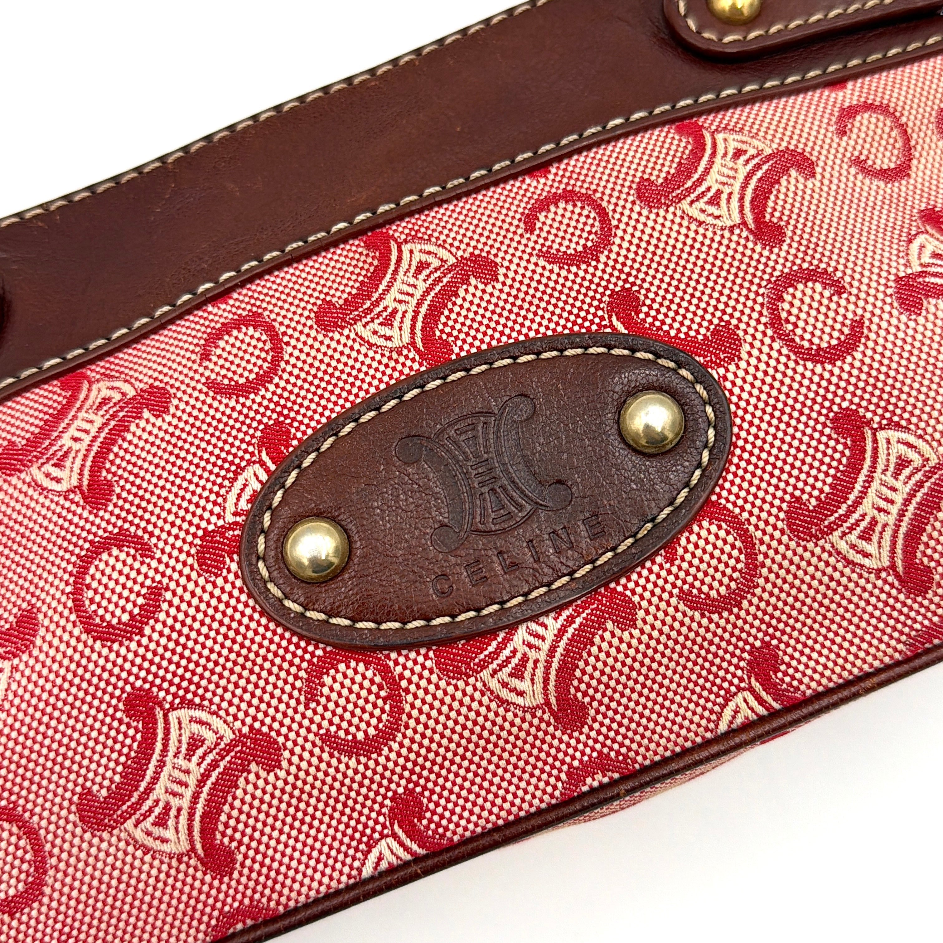Celine Macadam shoulder bag in red coated canvas with brown leather trim and gold-tone hardware.