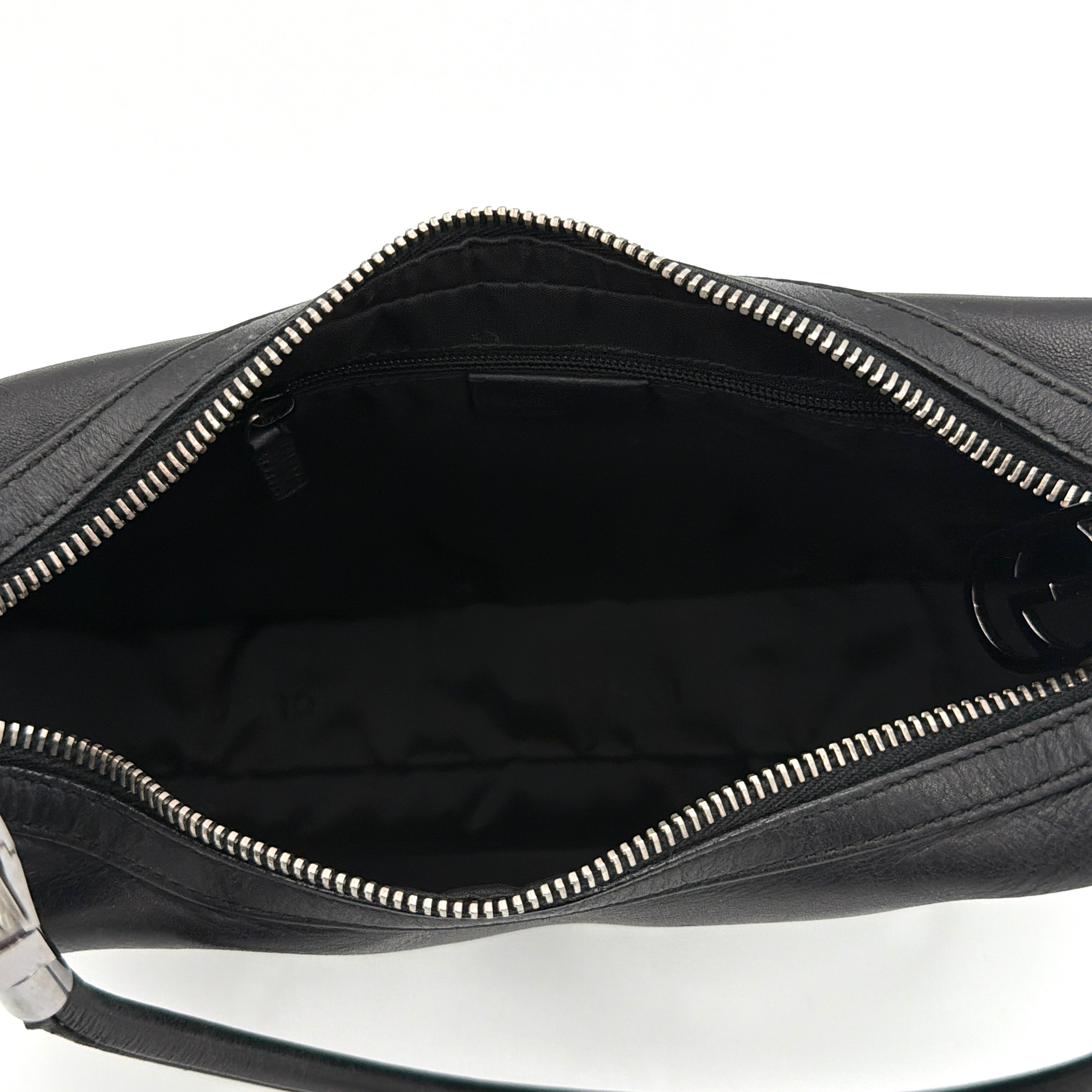 Gucci GG Leather Hobo Shoulder Bag in black smooth leather with sculptural silver-tone hardware and signature GG zip pull.