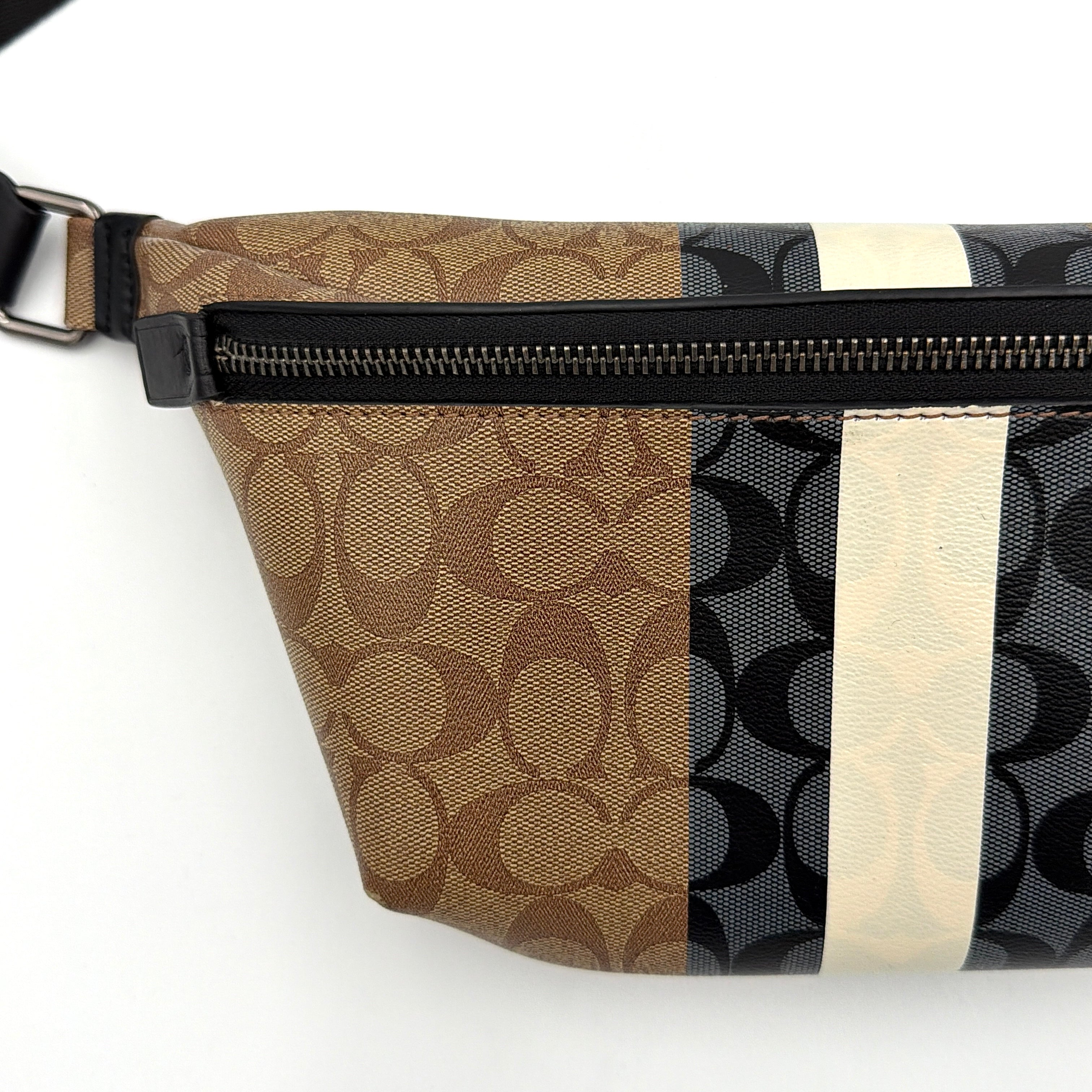 Coach Signature Warren Stripe Belt Bag in beige canvas with black and ivory vertical stripes and adjustable black strap.