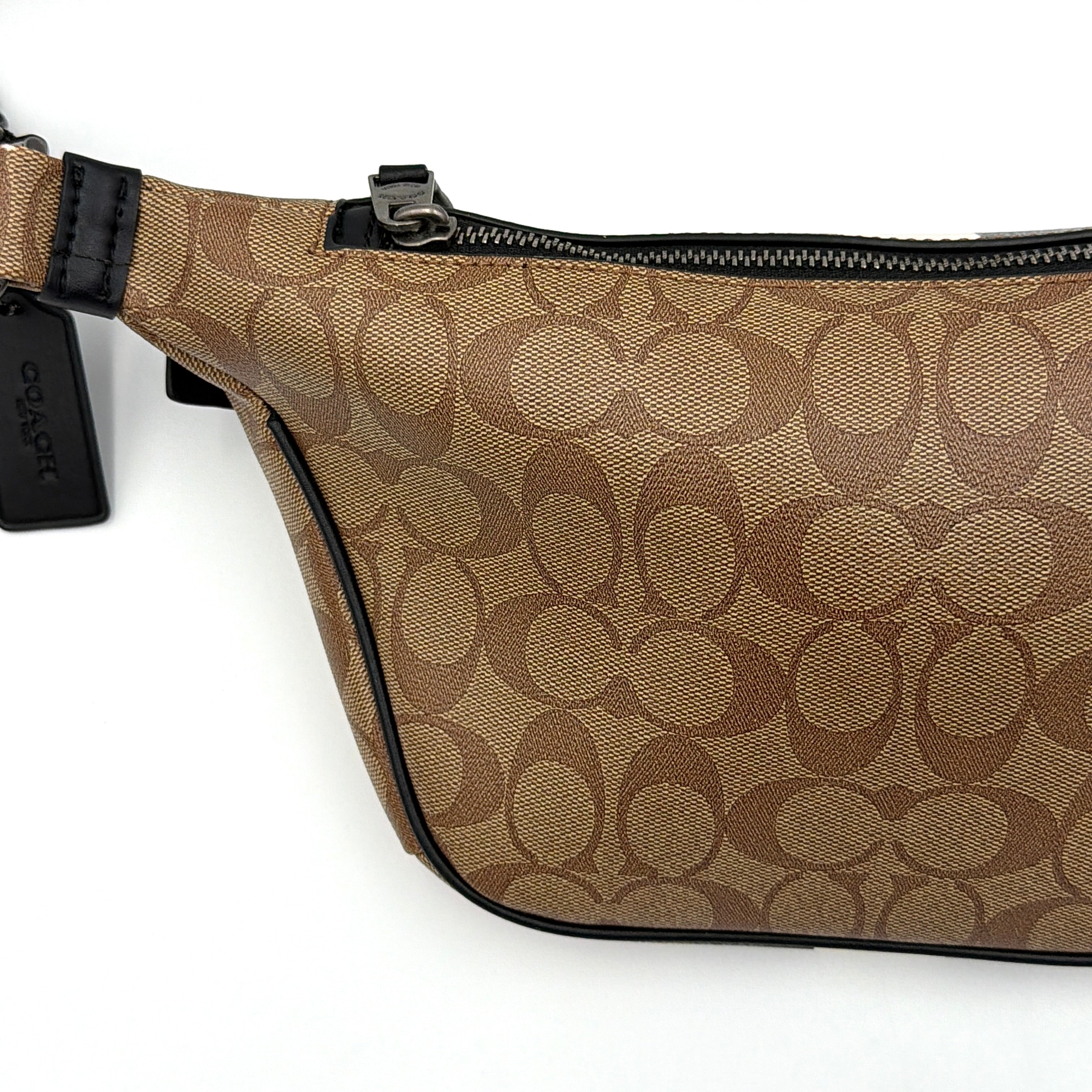 Coach Signature Warren Stripe Belt Bag in beige canvas with black and ivory vertical stripes and adjustable black strap.
