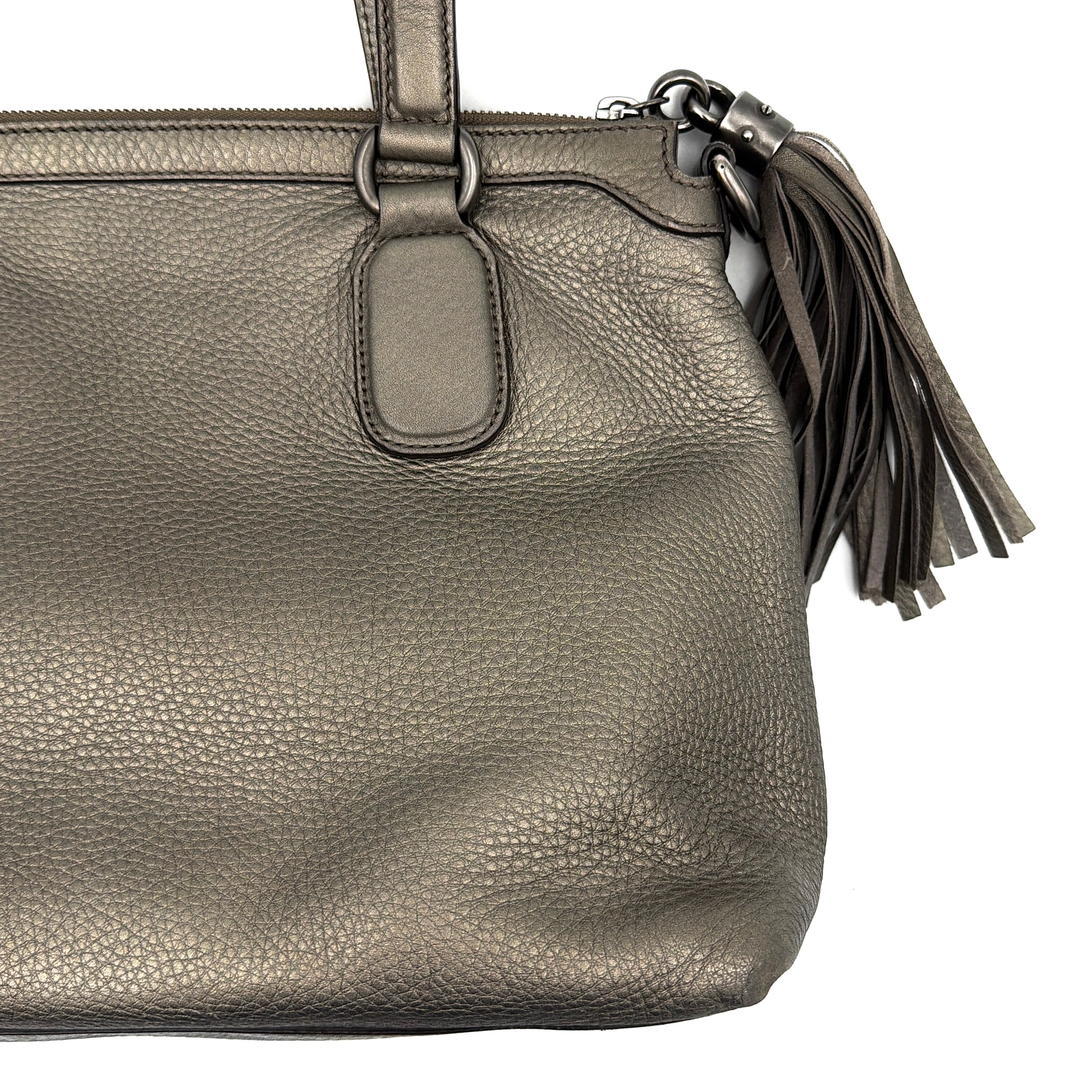 Gucci GG Soho Shoulder Bag in grey pebbled leather, featuring dual top handles, oversized stitched GG logo, and a leather tassel zip pull.