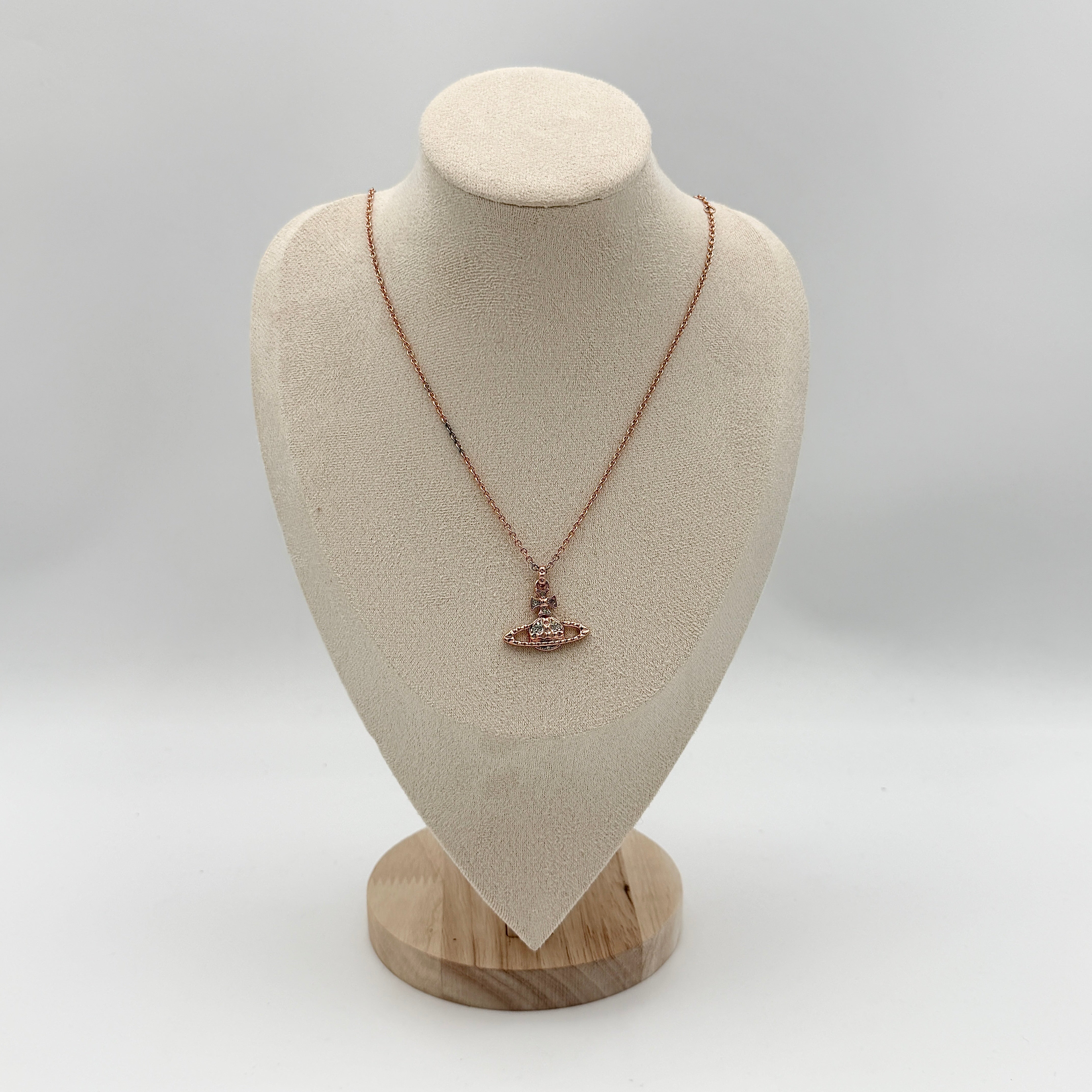 Vivienne Westwood Orb Necklace in rose gold and silver, presented on a fine chain with the signature crystal-embellished pendant.