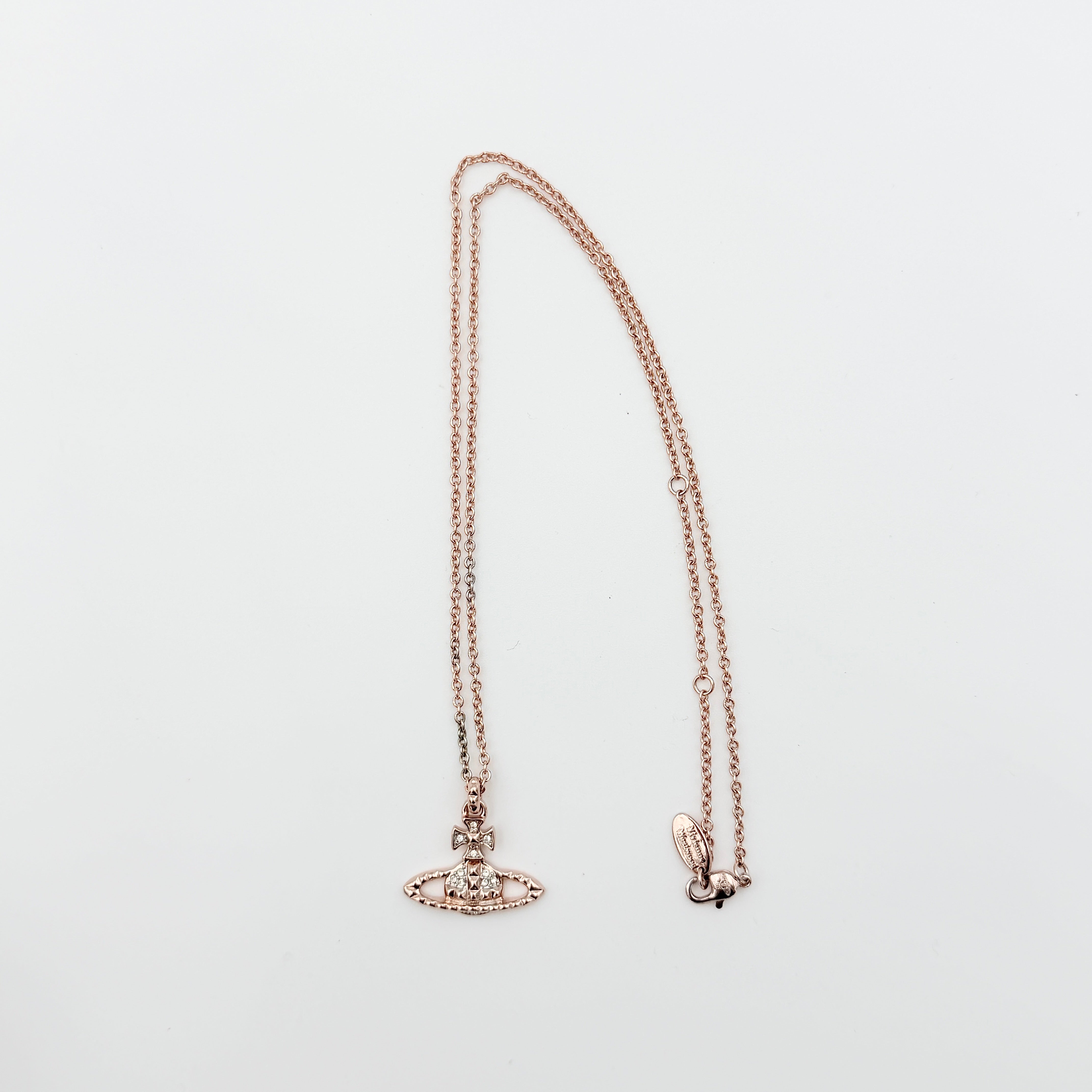 Vivienne Westwood Orb Necklace in rose gold and silver, presented on a fine chain with the signature crystal-embellished pendant.
