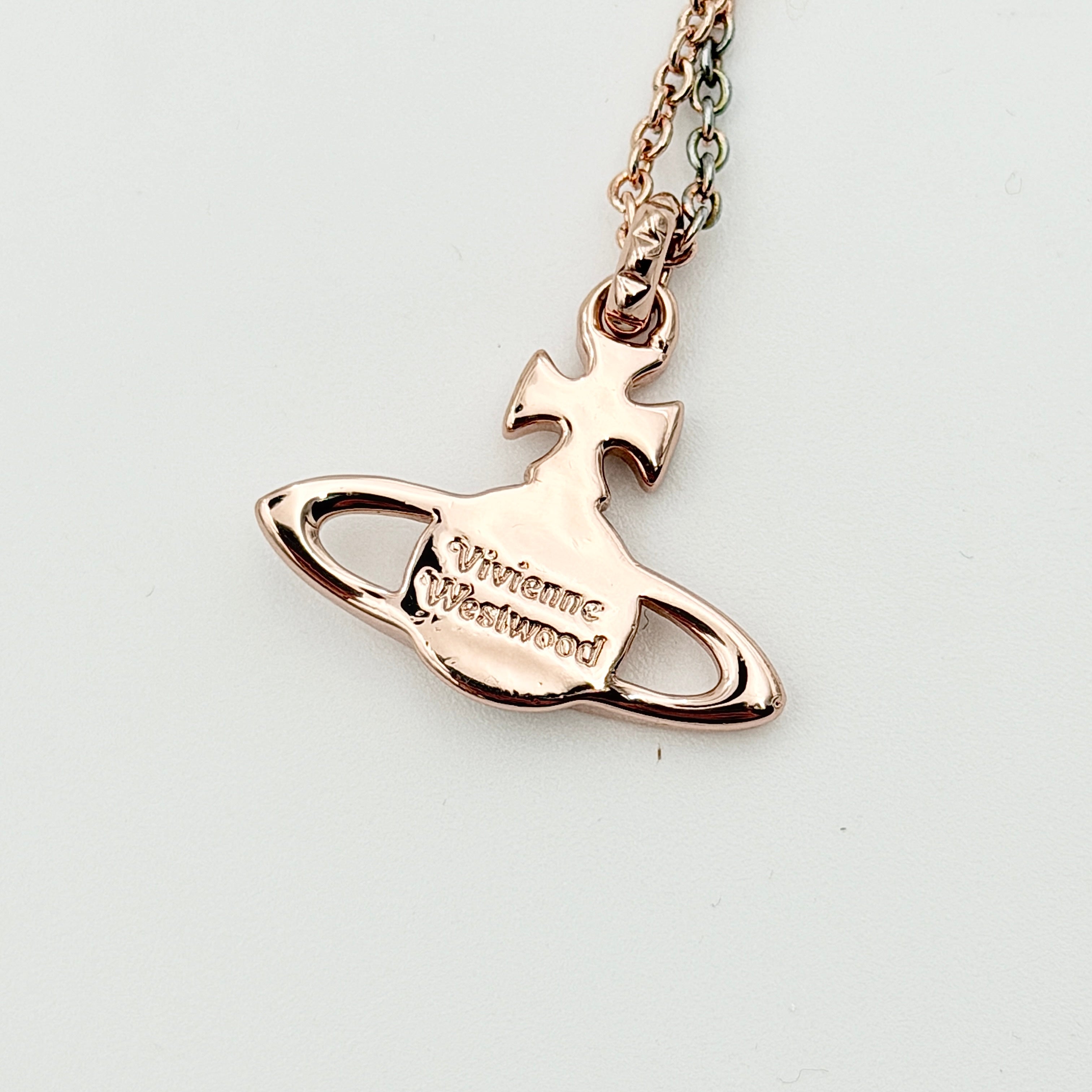 Vivienne Westwood Orb Necklace in rose gold and silver, presented on a fine chain with the signature crystal-embellished pendant.