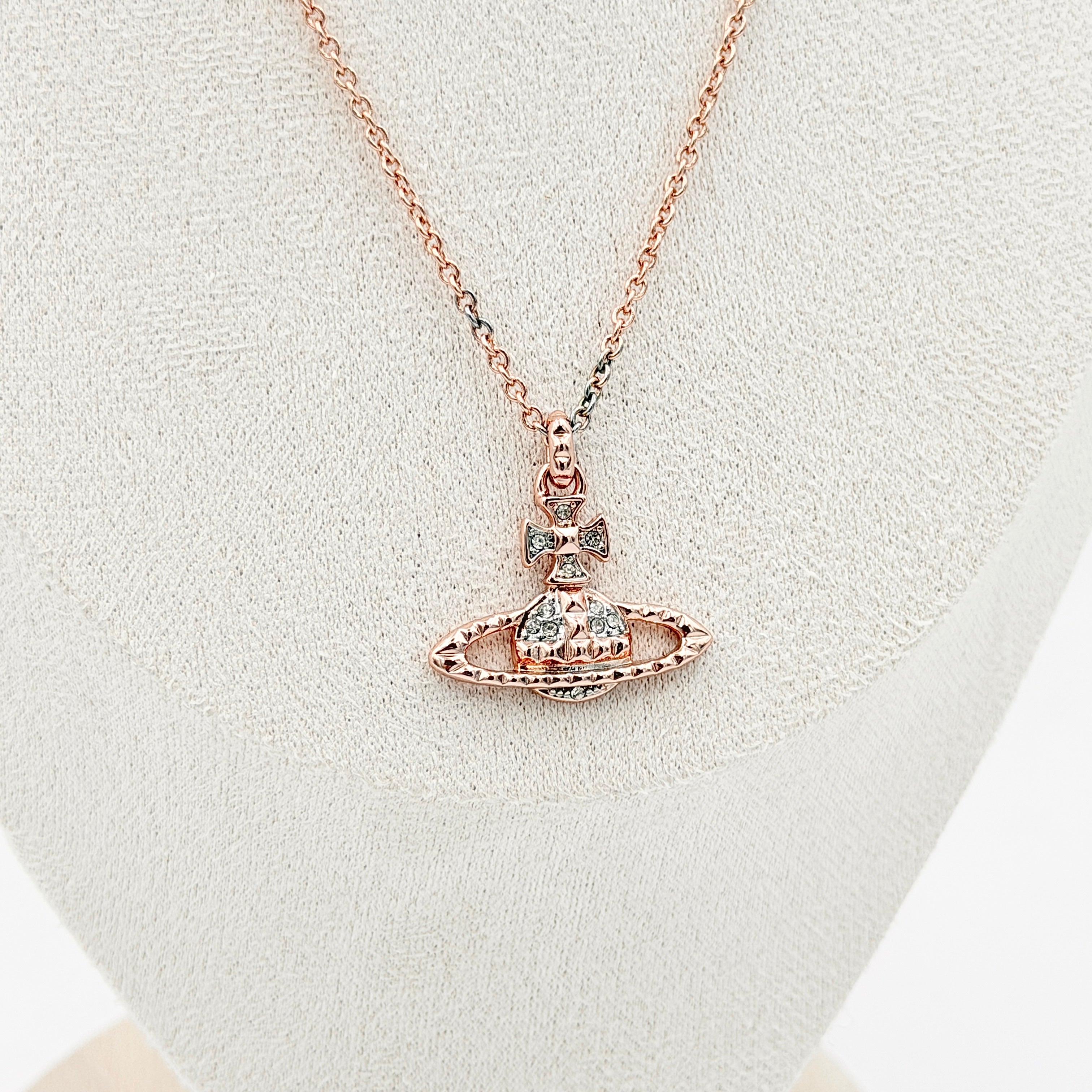 Vivienne Westwood Orb Necklace in rose gold and silver, presented on a fine chain with the signature crystal-embellished pendant.