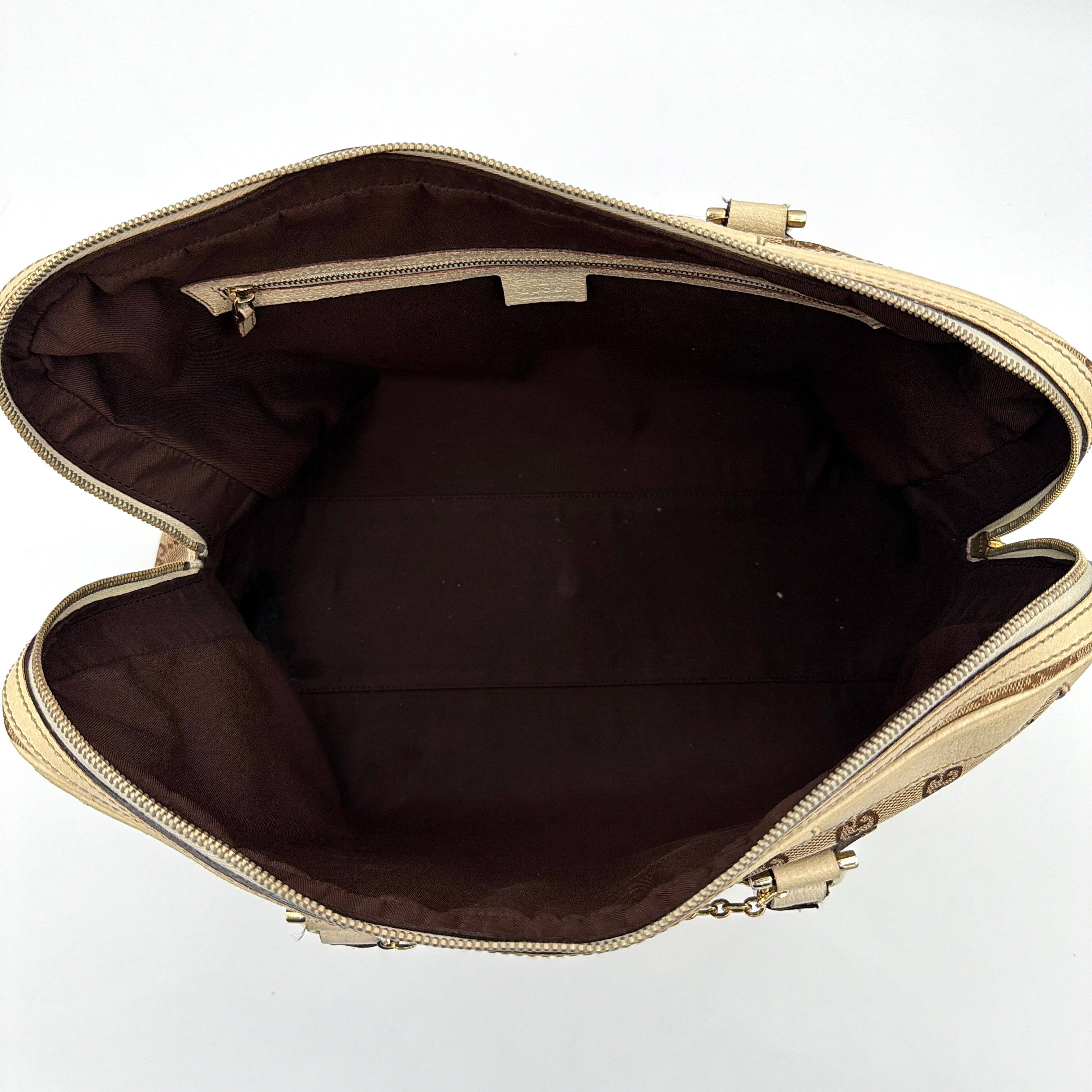 Gucci GG Monogram Stoffa Shoulder Bag in beige canvas with cream leather trim, iconic web stripes, and gold-tone chain detail.
