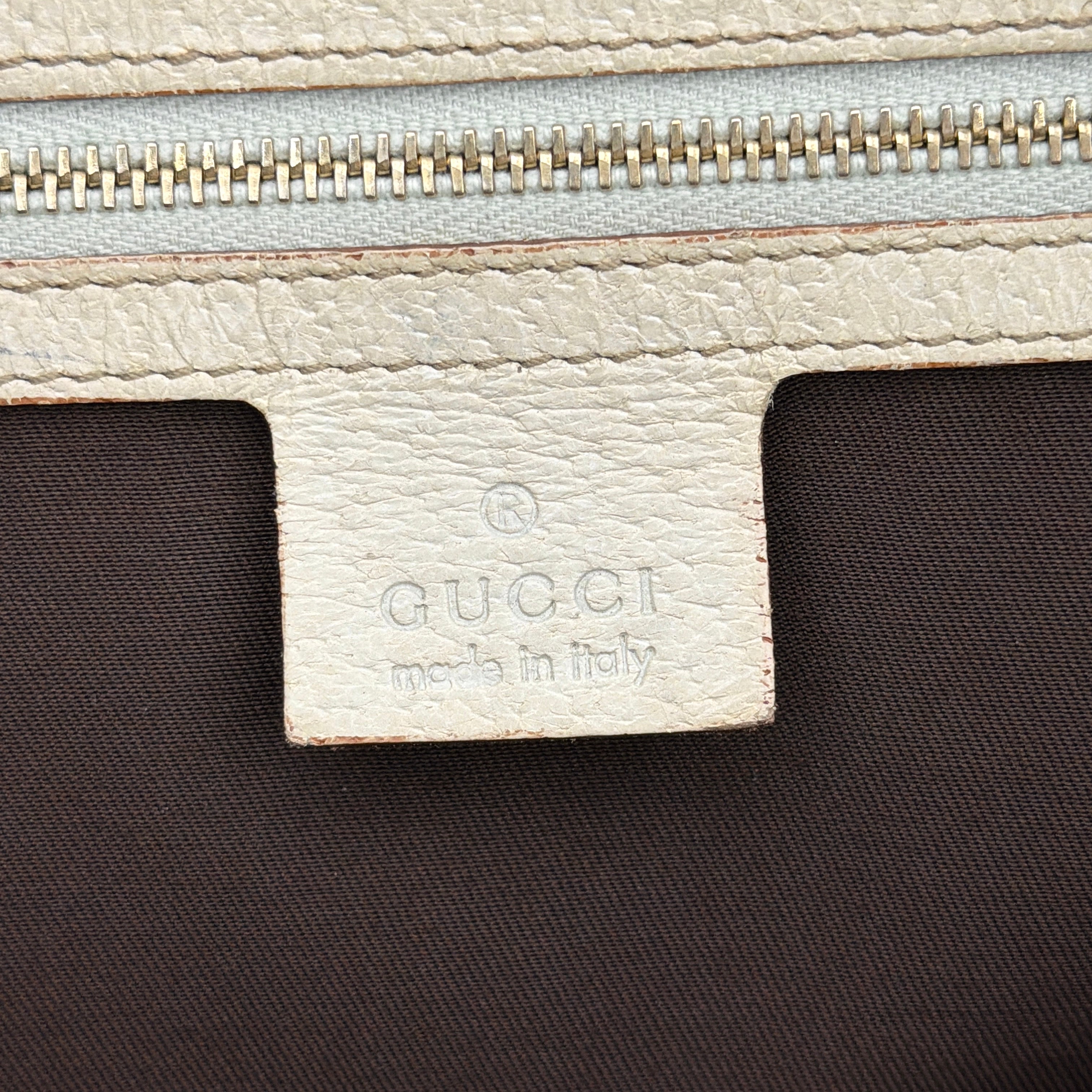 Gucci GG Monogram Stoffa Shoulder Bag in beige canvas with cream leather trim, iconic web stripes, and gold-tone chain detail.