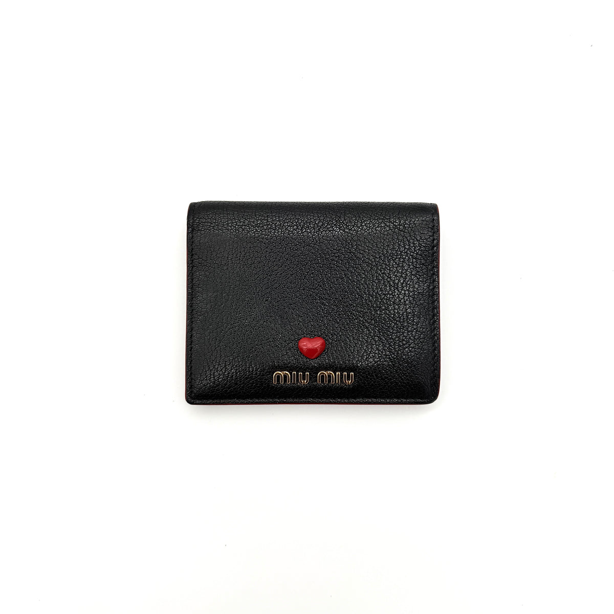 Miu Miu Madras Love Wallet in black grained leather with a gold logo and red heart detail on the front.
