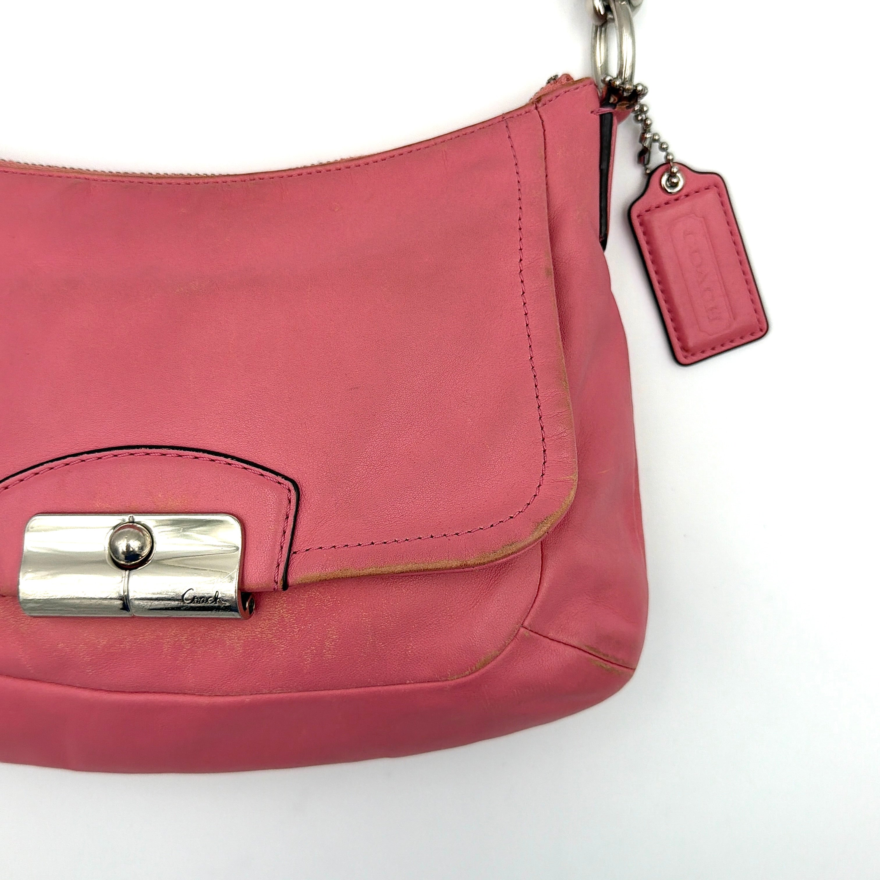 Coach Kristin 2Way Shoulder Bag in pink leather with silver hardware and detachable strap, displayed with both handle and crossbody option.