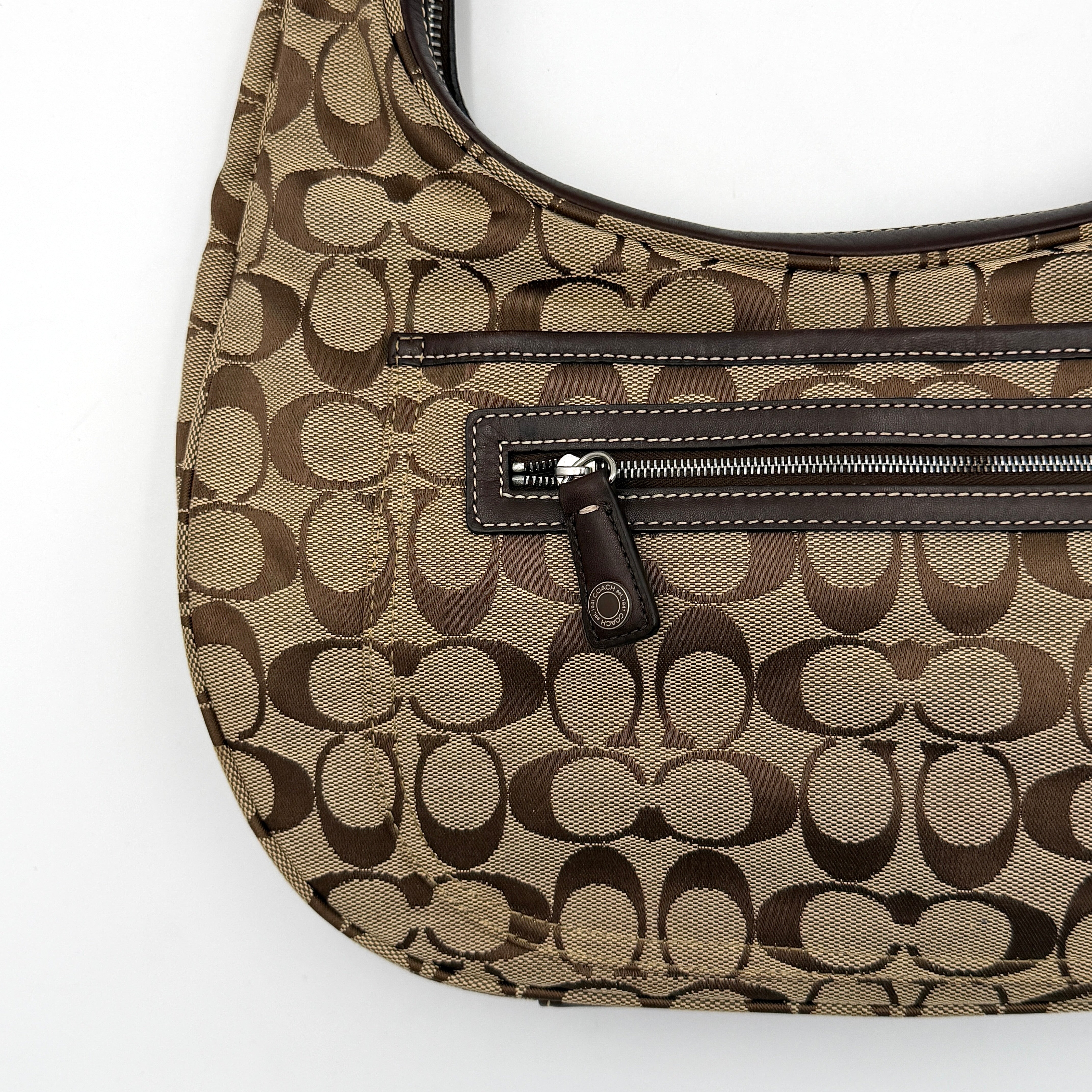 Coach Signature Hamilton Hobo Shoulder Bag in beige and brown jacquard, showcasing the iconic 'C' monogram with leather trim and silver hardware.