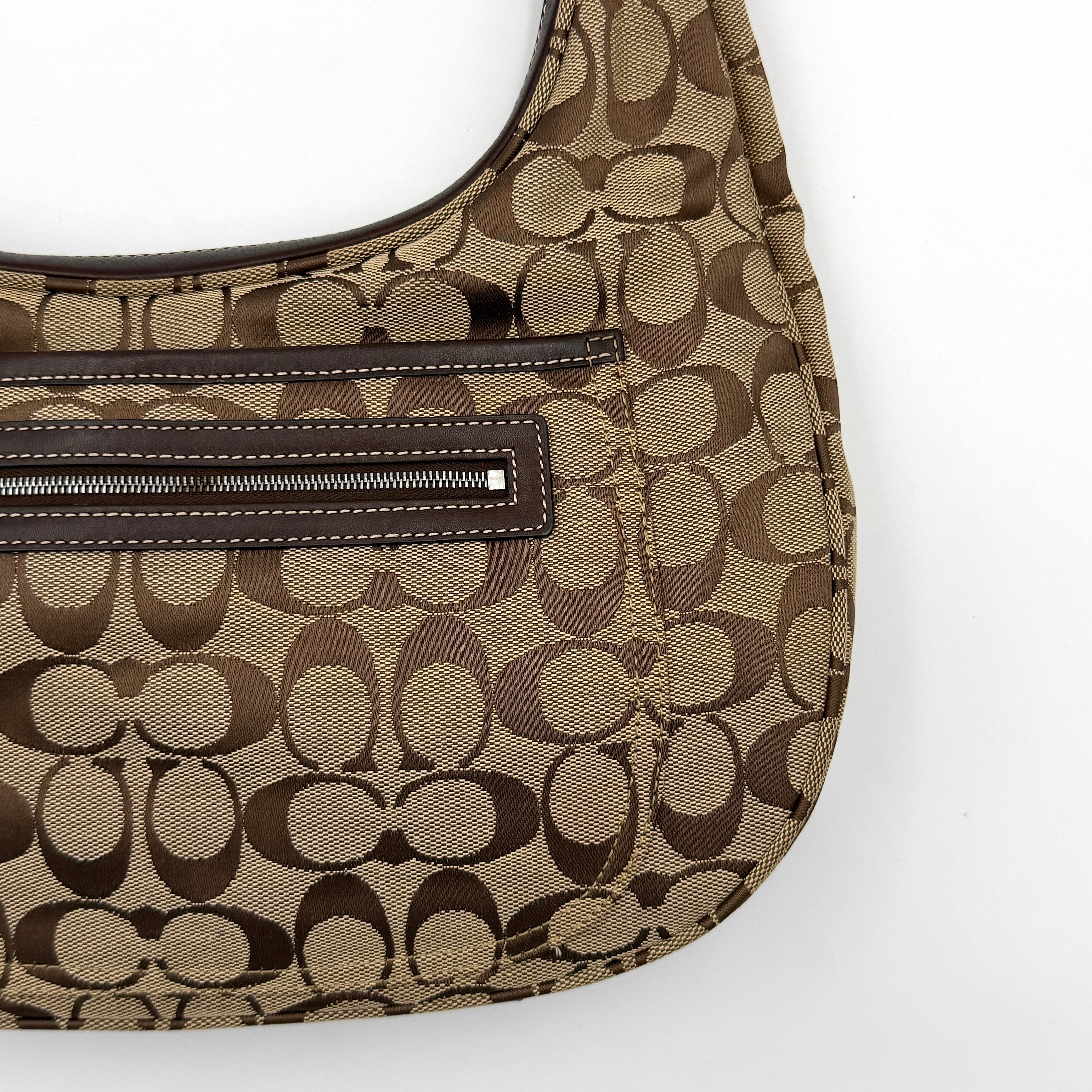Coach Signature Hamilton Hobo Shoulder Bag in beige and brown jacquard, showcasing the iconic 'C' monogram with leather trim and silver hardware.