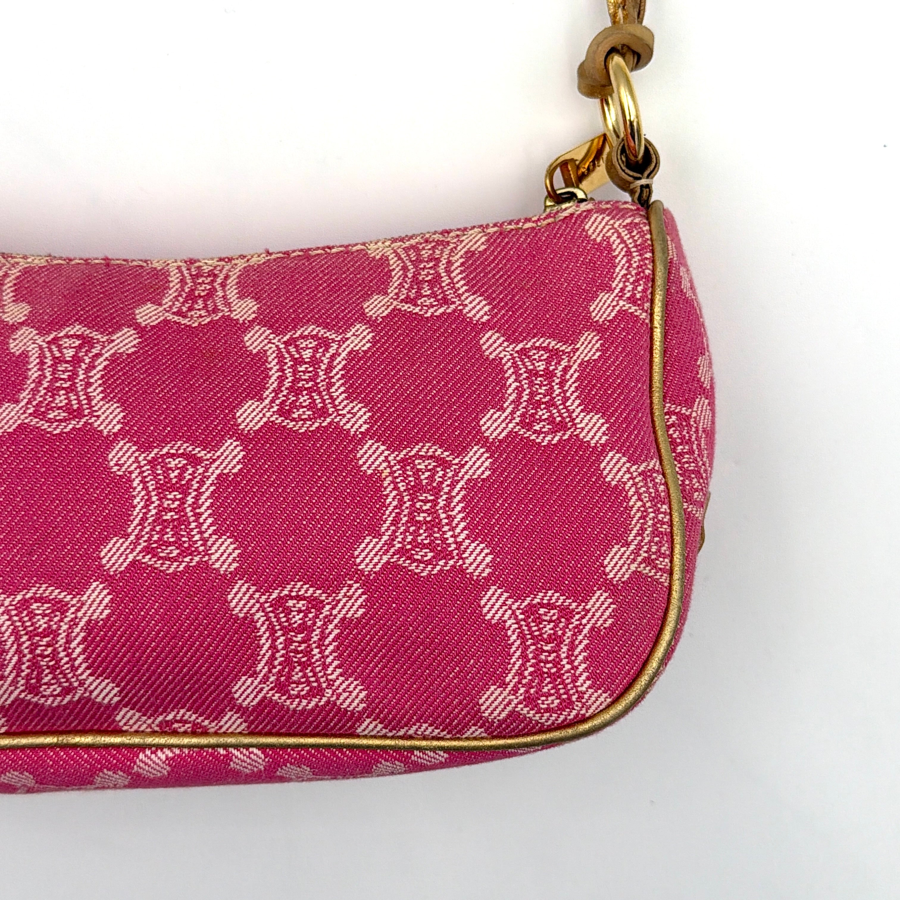 Front view of the Celine Macadam pink denim shoulder bag with gold-tone leather strap and triomphe monogram print.