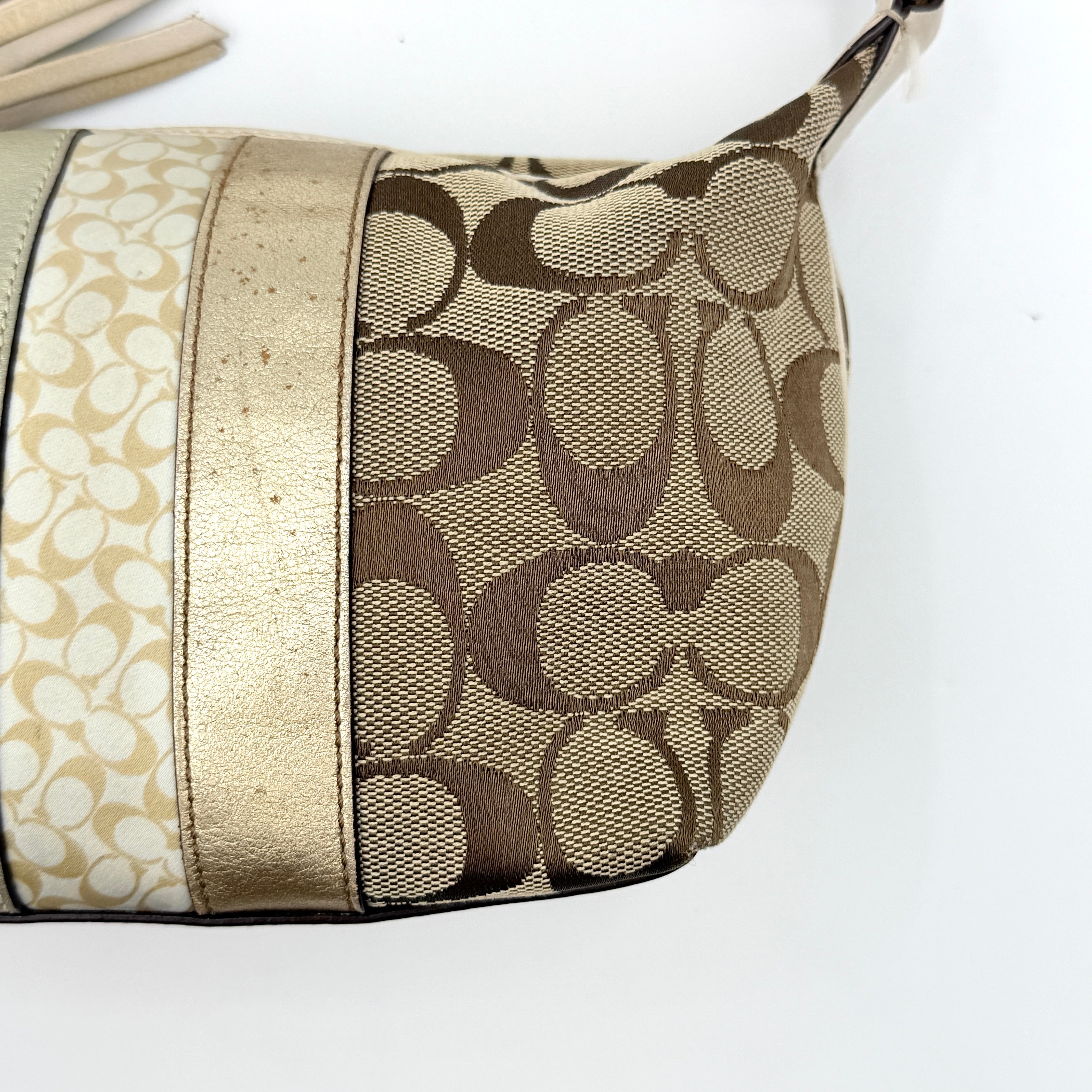 Coach Signature Stripe Mini Hobo Shoulder Bag in beige and gold with monogram canvas, cream leather trim, and gold stripes.