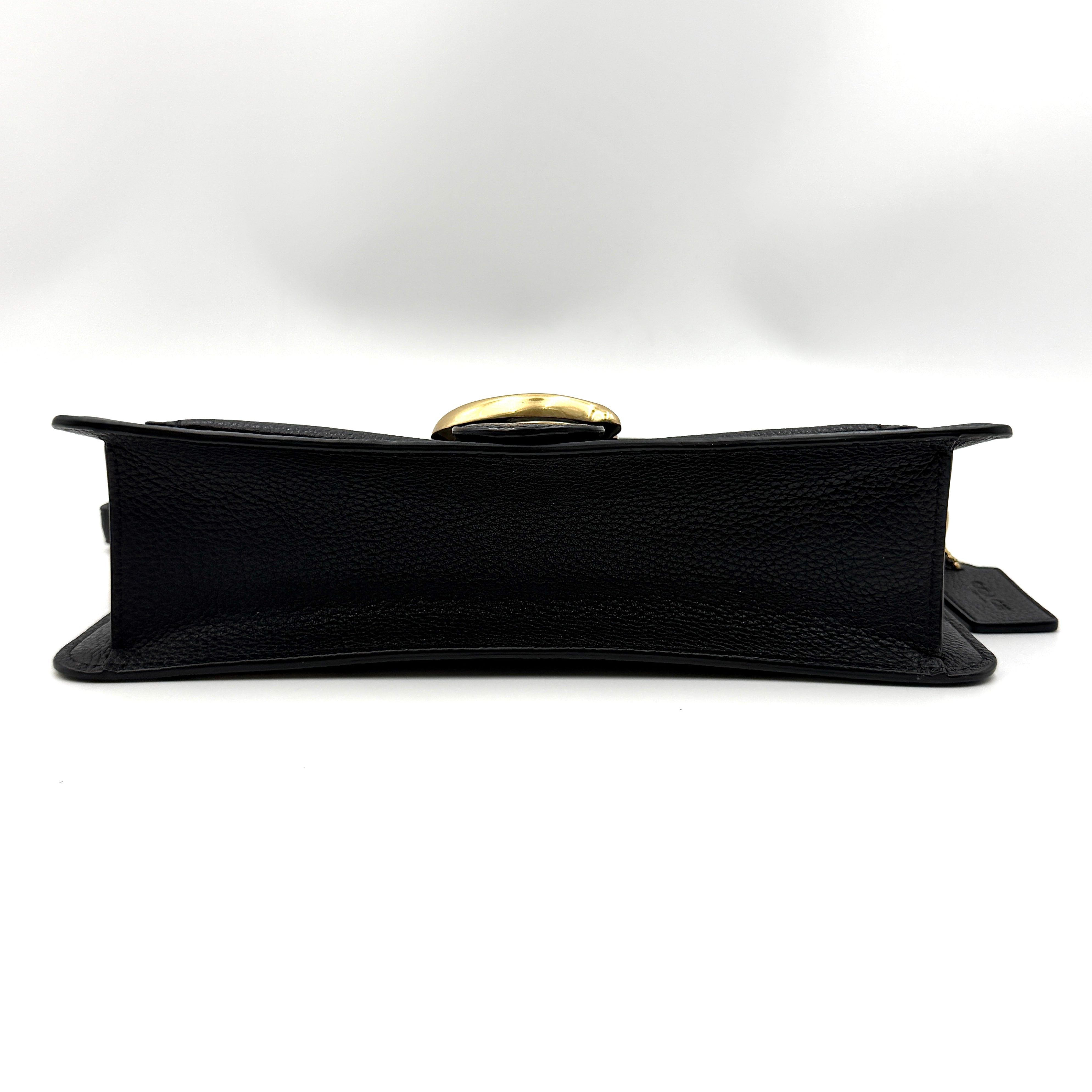 Coach Tabby 26 black shoulder bag with gold hardware and detachable straps, shown with dust bag and care card.