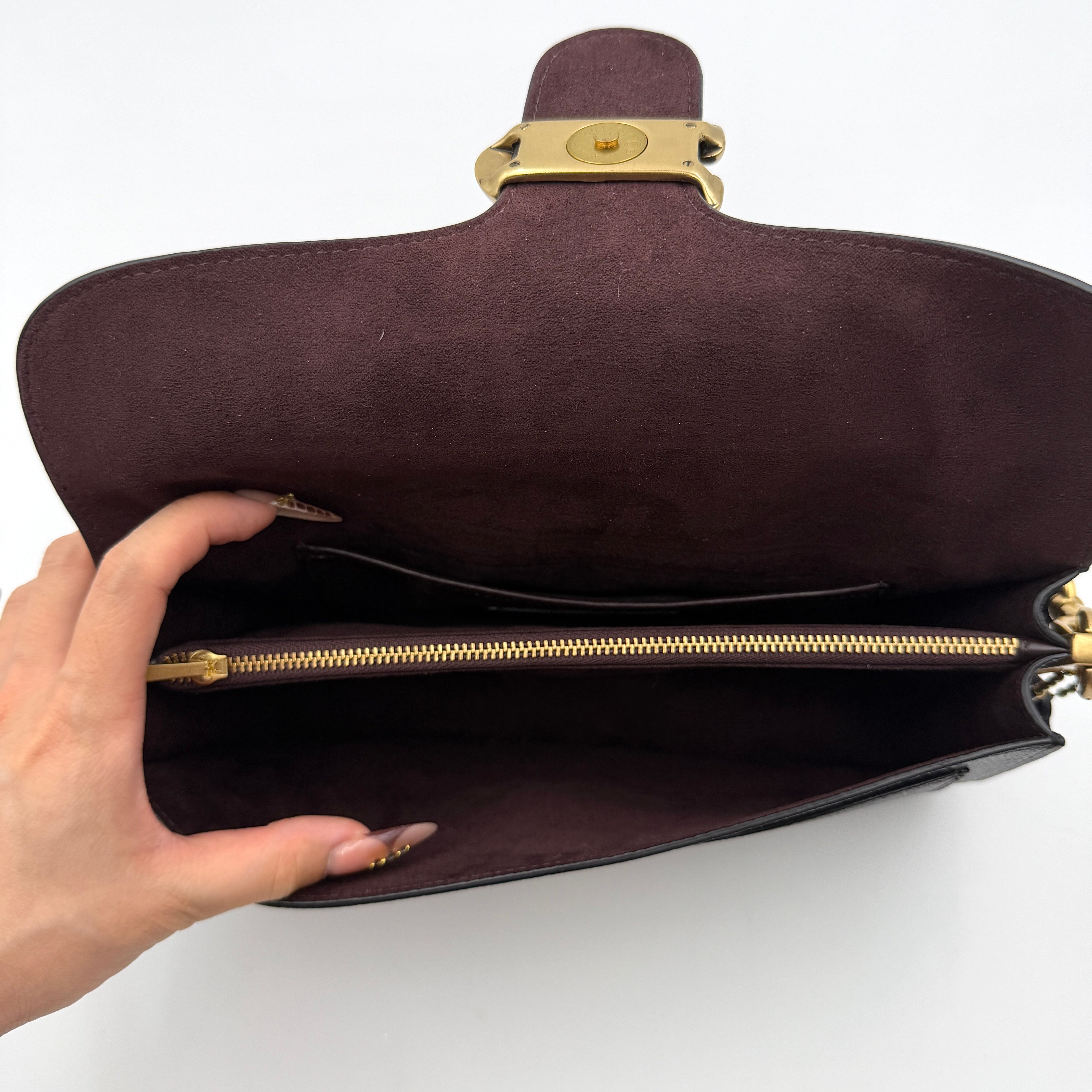 Coach Tabby 26 black shoulder bag with gold hardware and detachable straps, shown with dust bag and care card.