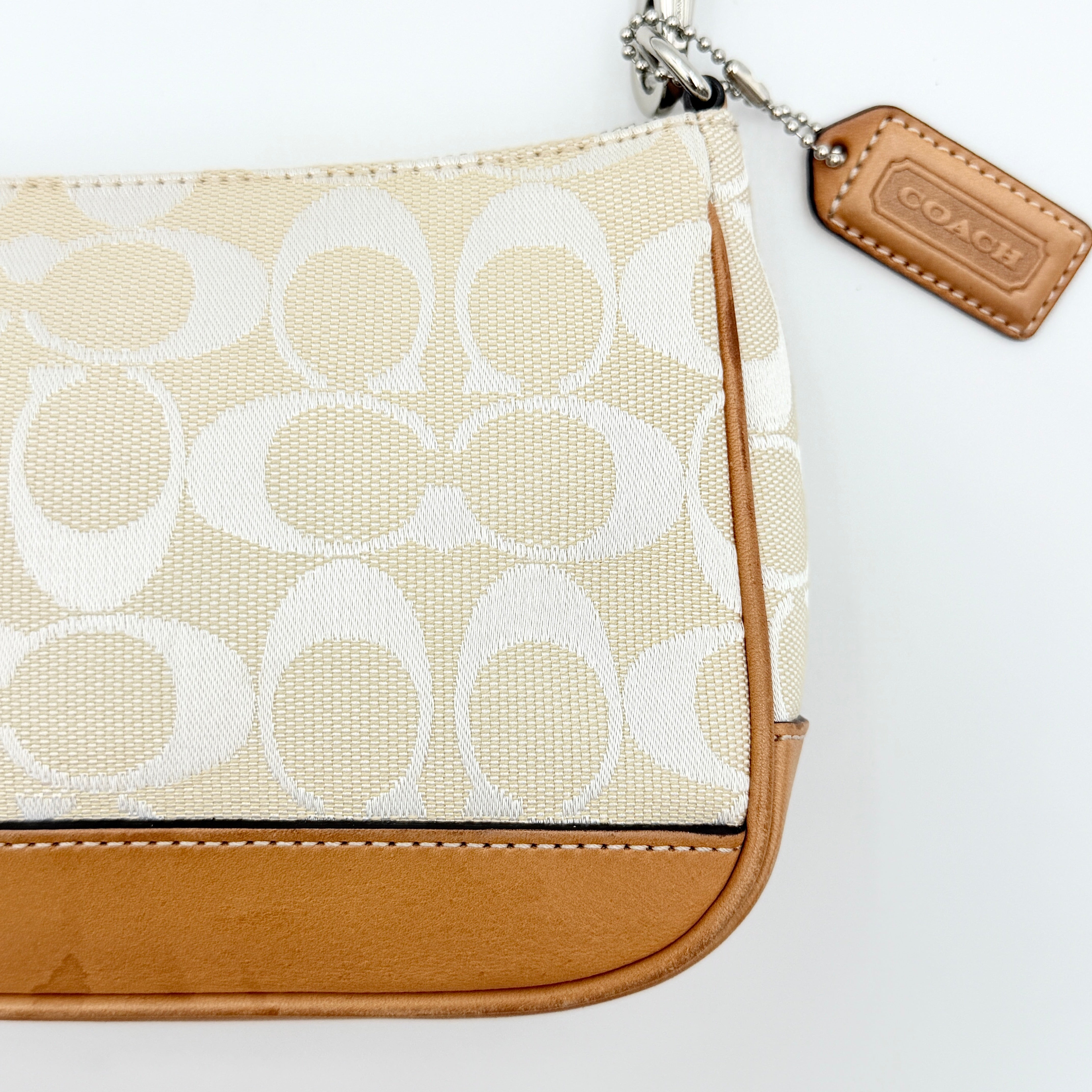 Coach Y2K Demi Shoulder Bag in cream and tan jacquard canvas with leather trim and signature tag.