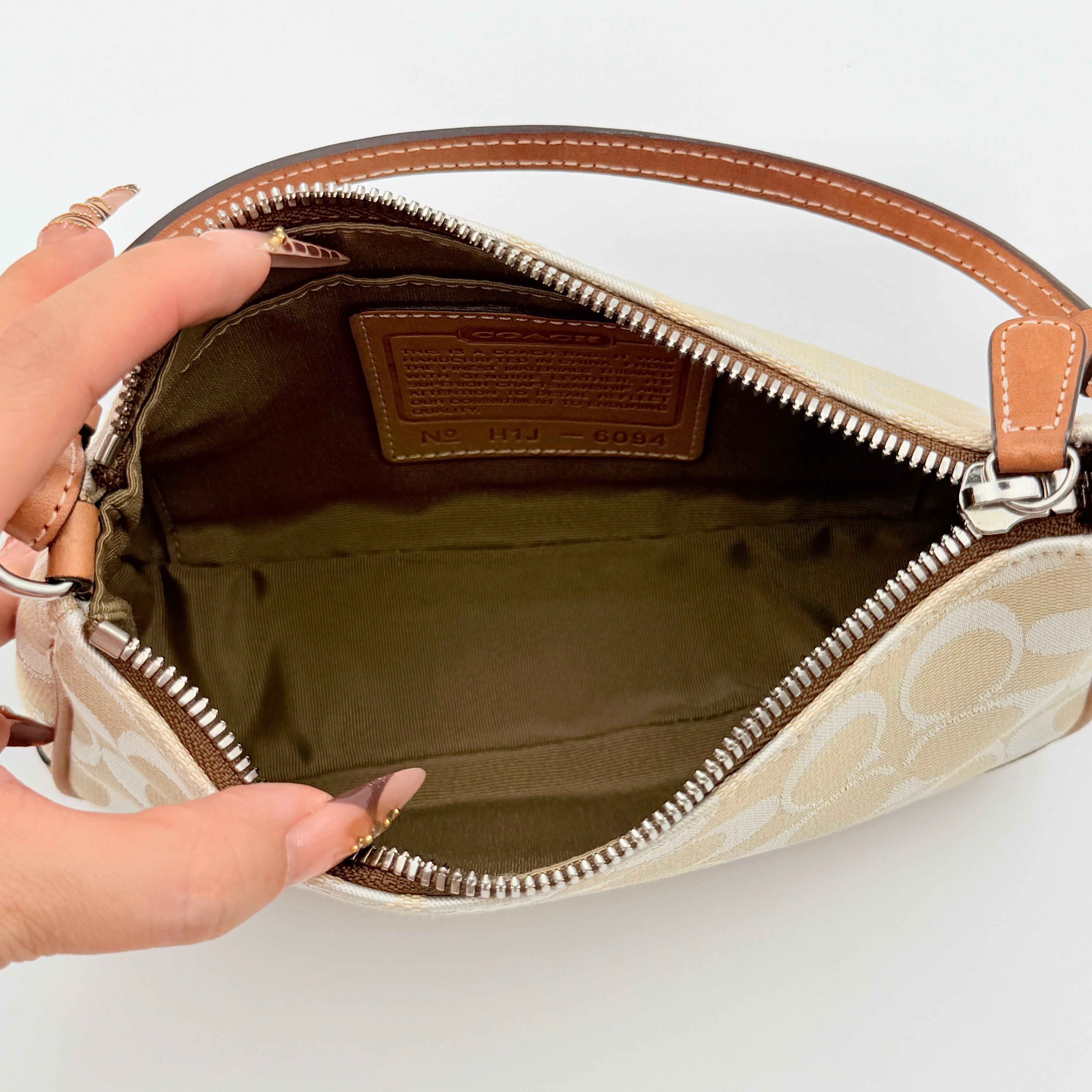 Coach Y2K Demi Shoulder Bag in cream and tan jacquard canvas with leather trim and signature tag.