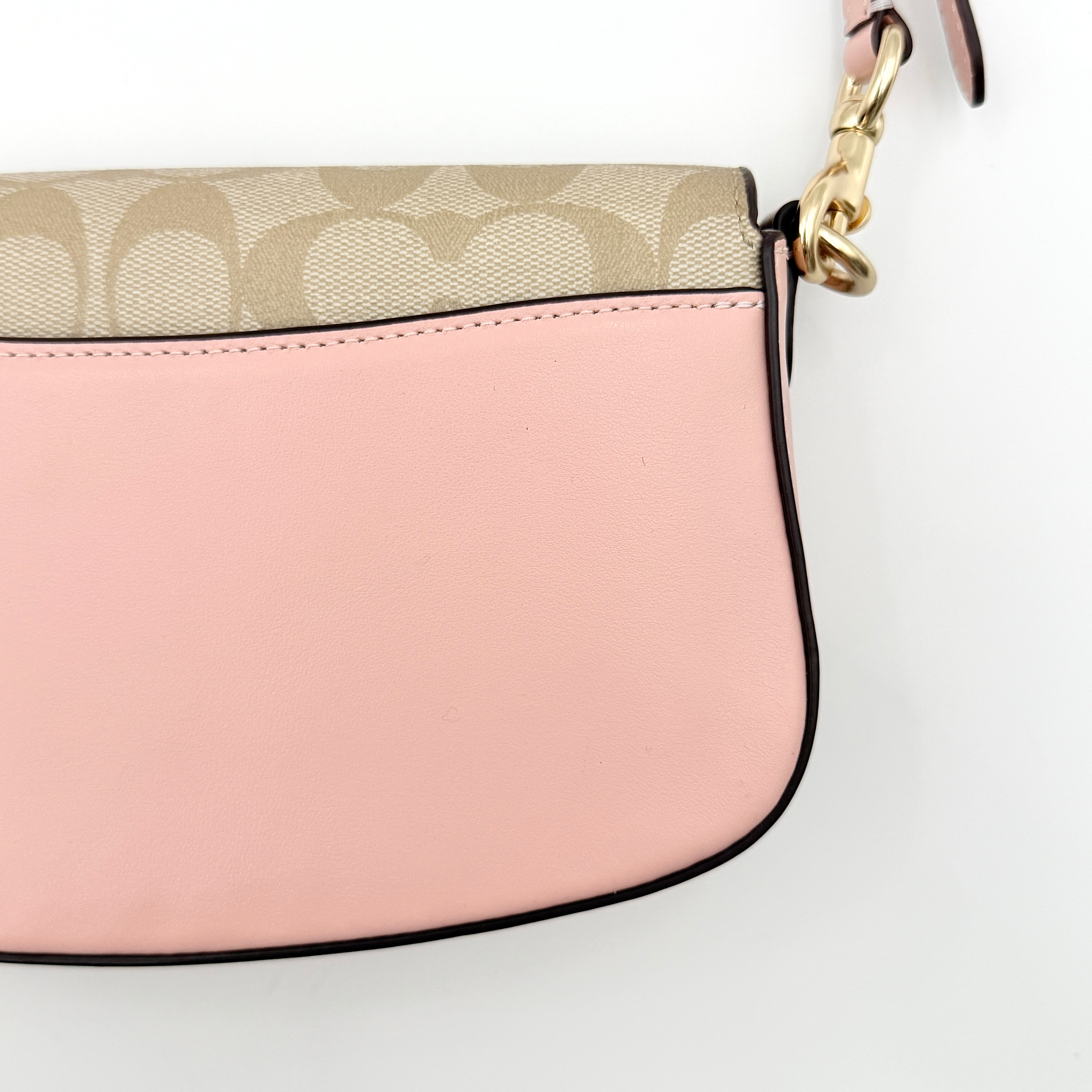 Coach X Observed By Us Andrea Shoulder Bag in beige monogram canvas with pink illustrations and pink leather strap.