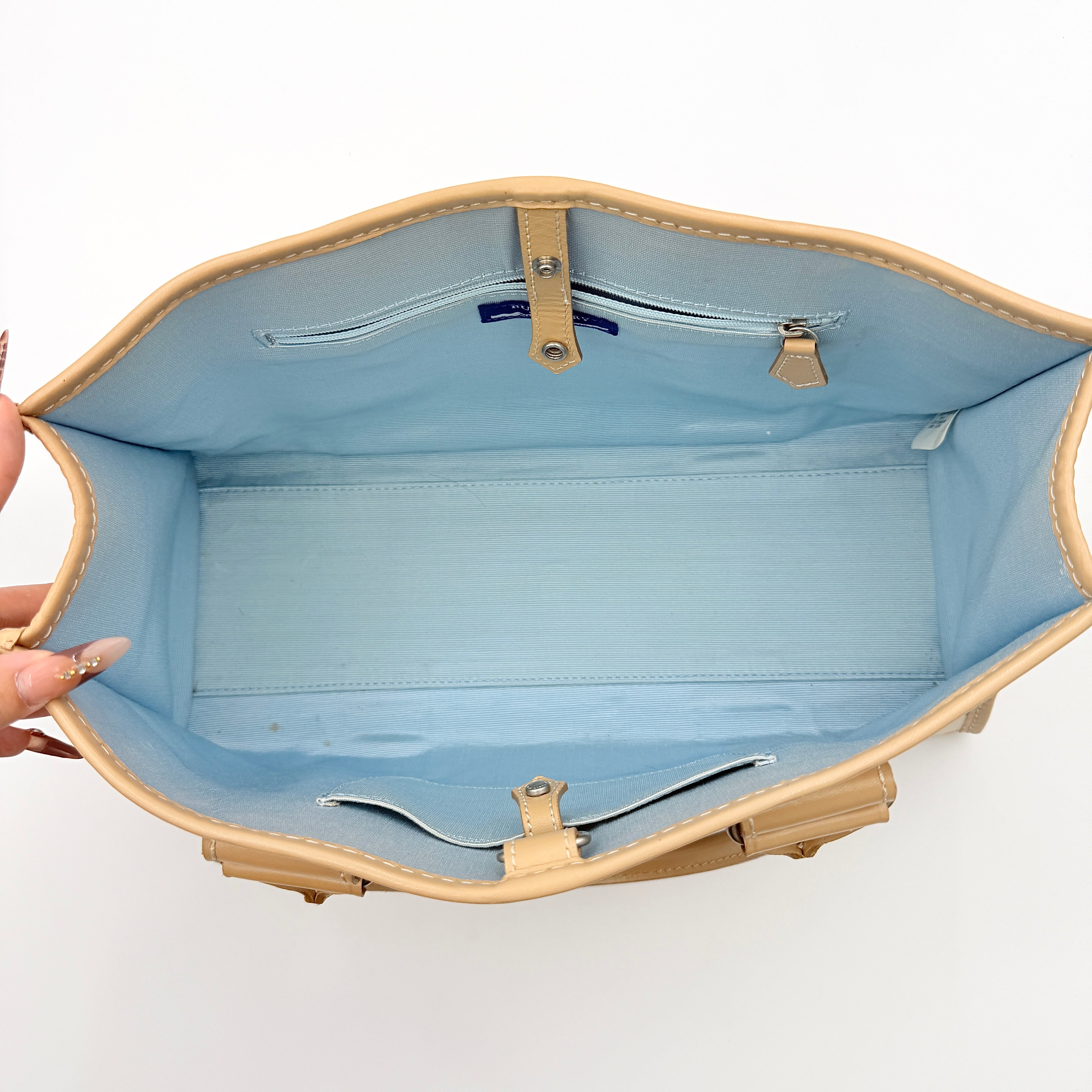 Burberry Blue Label Nova Check handbag in beige with leather trim and double top handles, displayed against a white background.